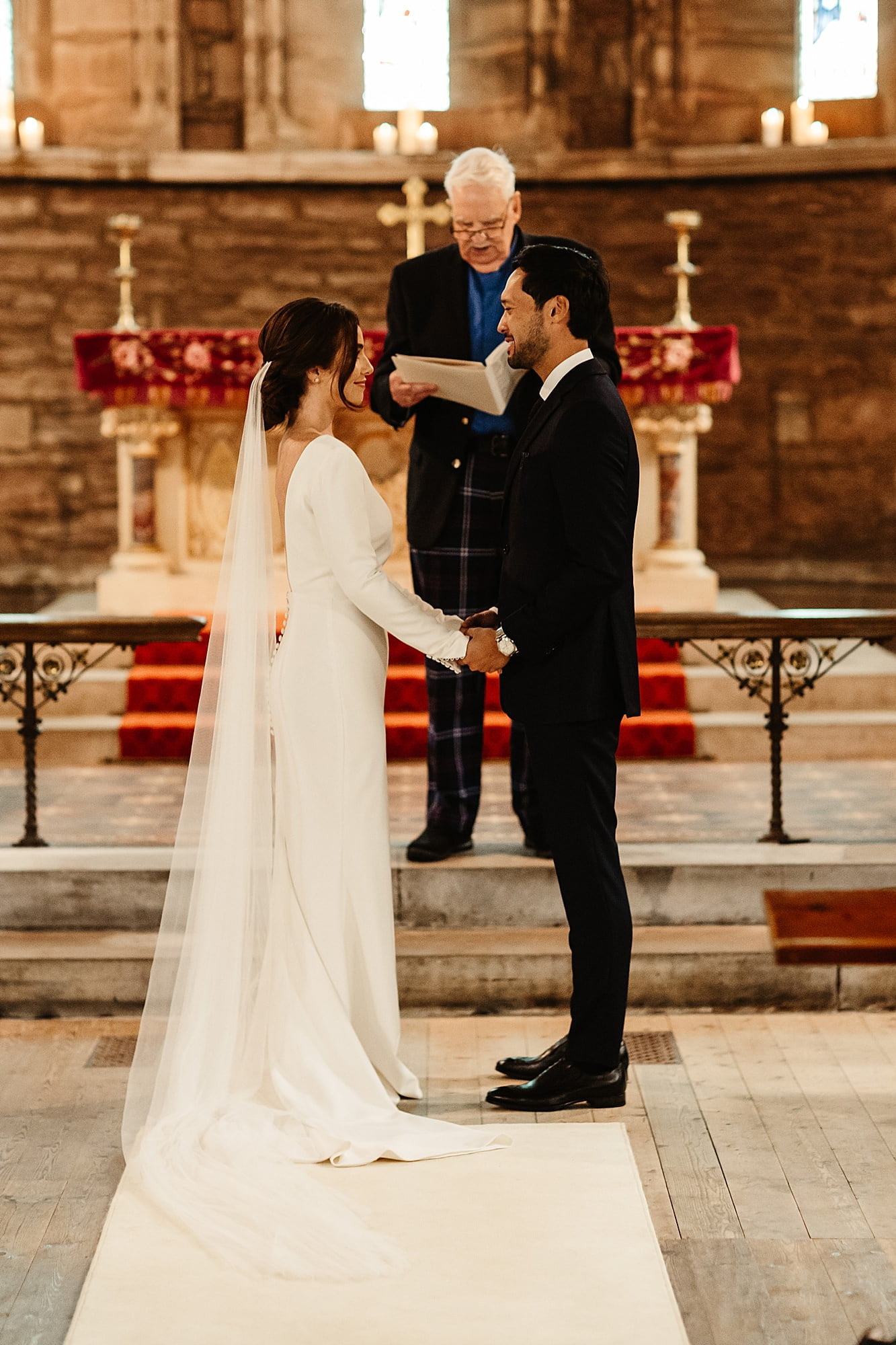 bride and groom wedding ceremony drumtochty castle inside St Palladius church