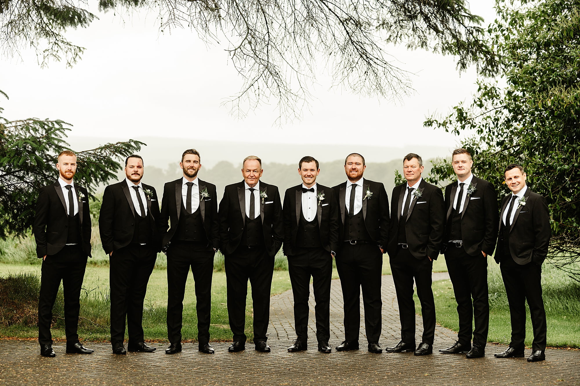 highwards estate groom and groomsmen black tie suits group photos outside