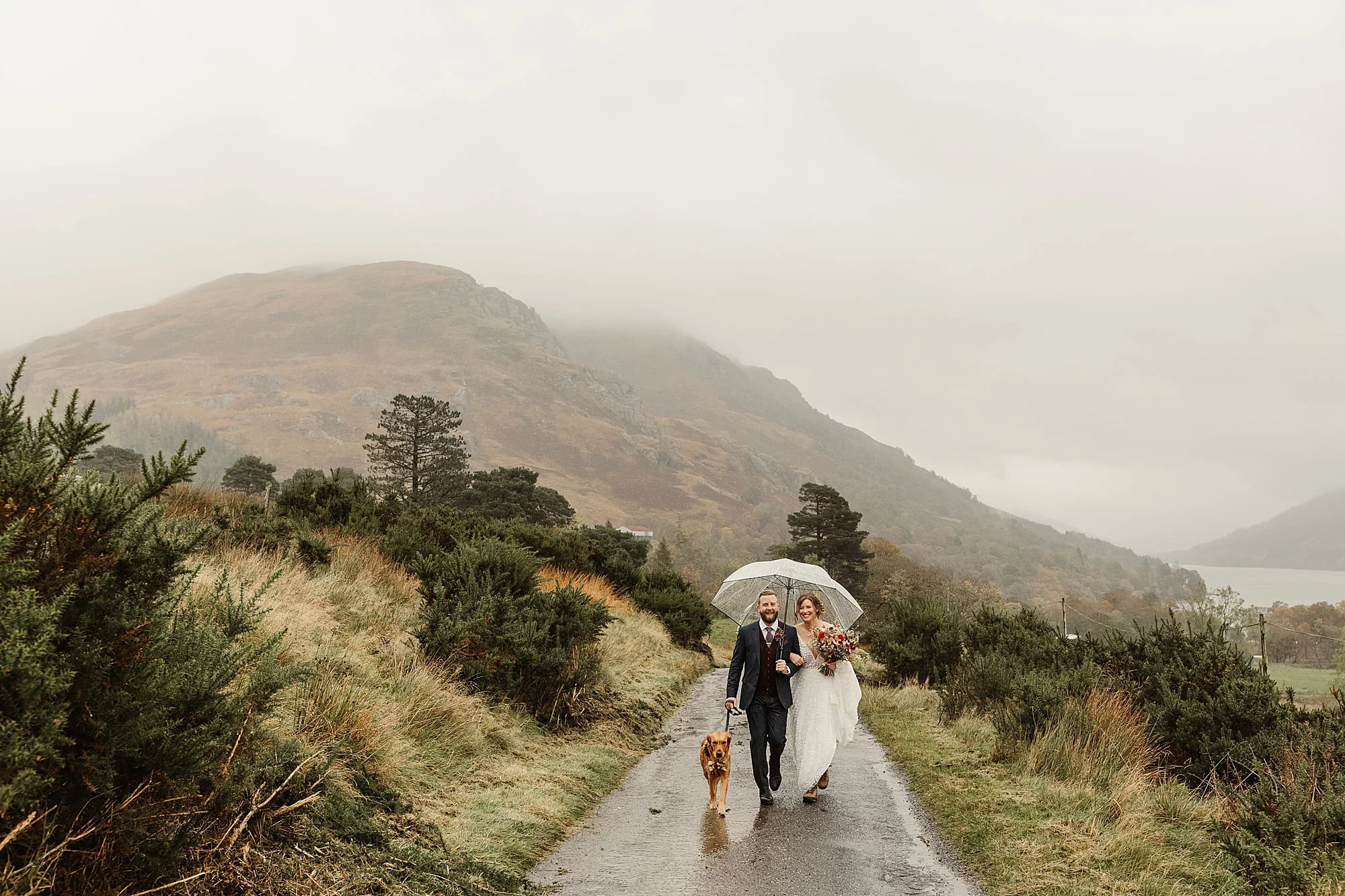 monachyle mhor elopement outside raining umbrella walk to ceremony