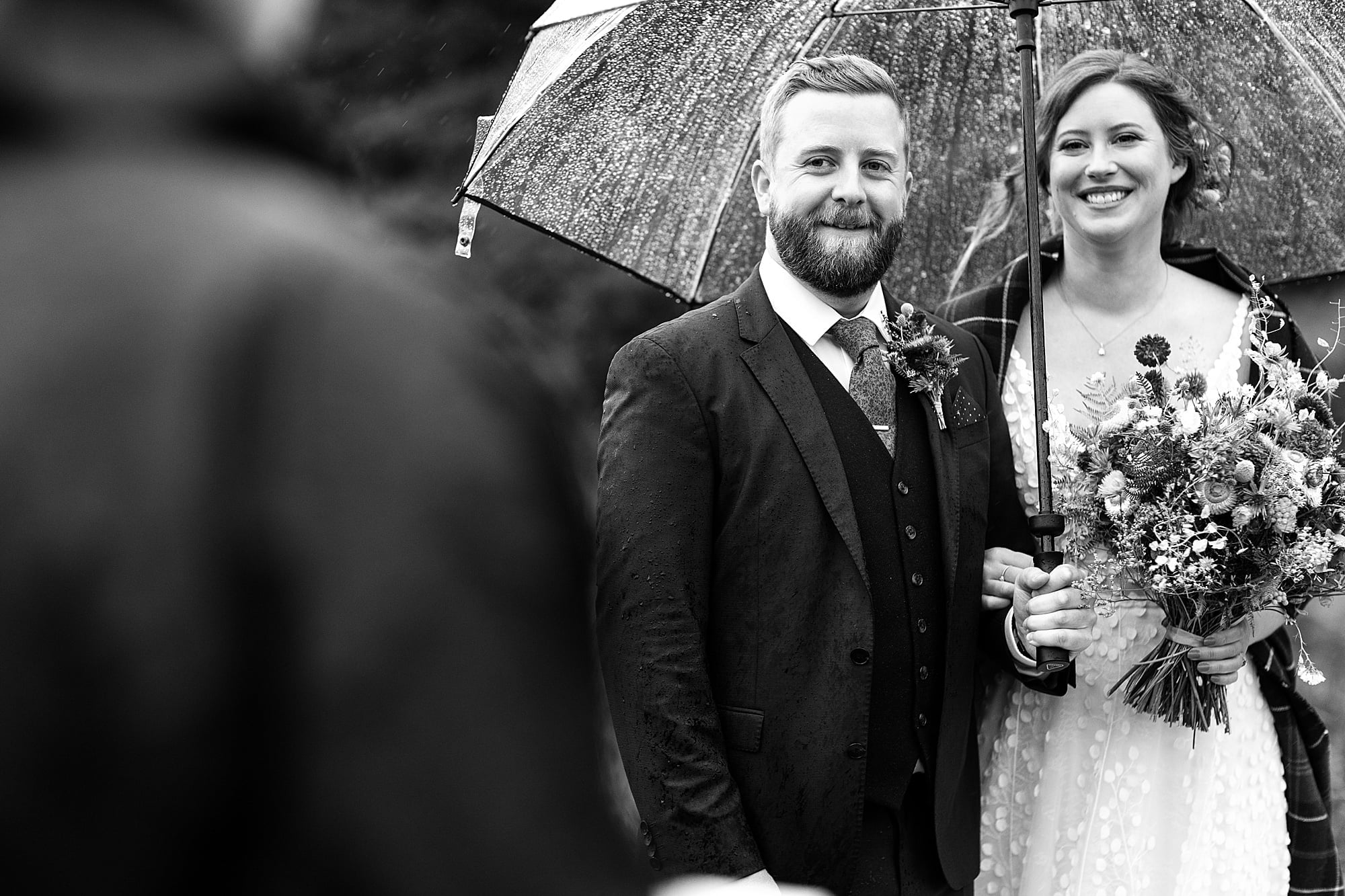 monachyle mhor ceremony outside elopement in the rain with umbrella