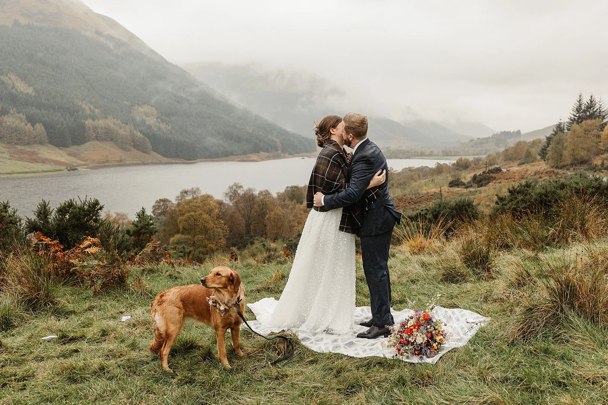 monachyle mhor ceremony outside elopement in the rain with their dog first kiss
