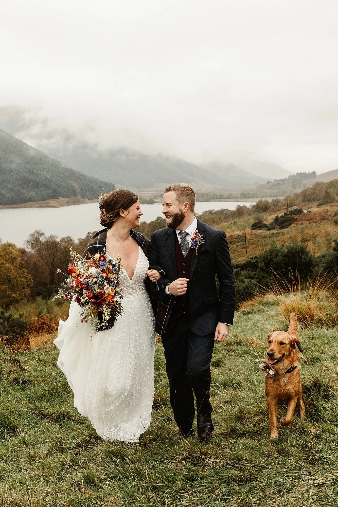 monachyle mhor ceremony outside elopement in the rain Layla Robinson Design dried flower bouquet with dog just married
