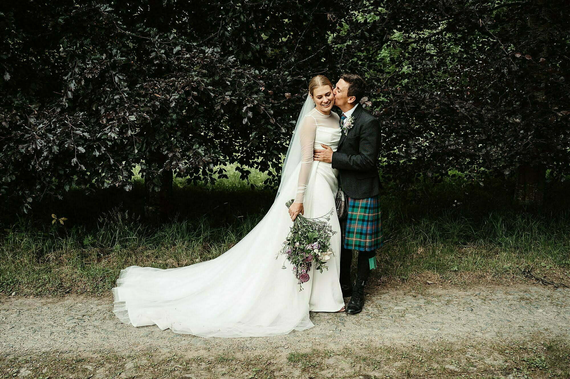 couple photos bride and groom portraits photographs wardhill castle kim dalglish bouquet flowers Kyha Studios dress