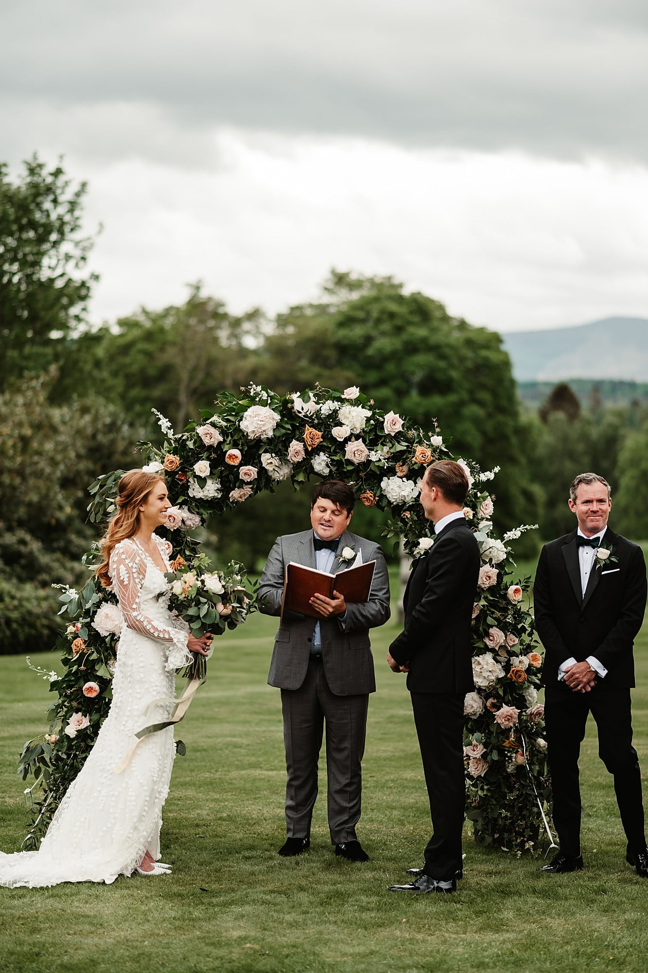 raemoir house outdoor ceremony wedding bride and groom hays flowers Zegna suit Alexandra Grecco