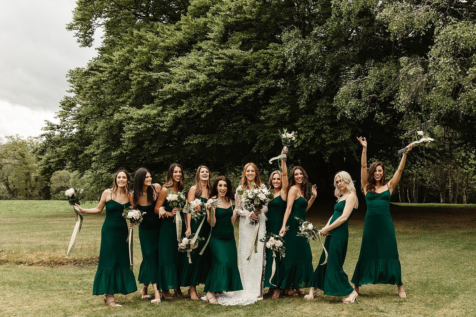 raemoir house wedding photography group photo casual hays flowers bridesmaids green dresses outdoors