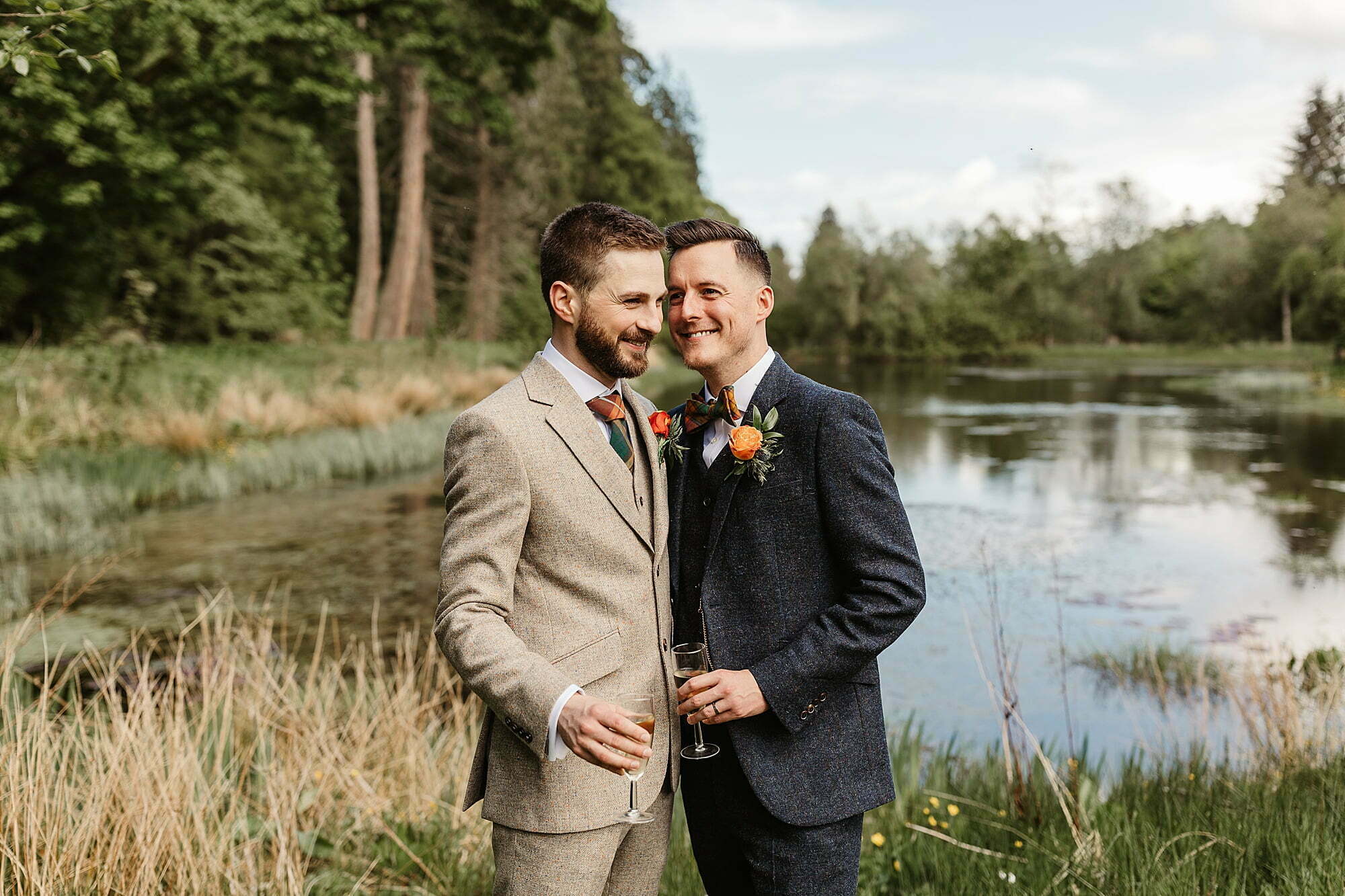 drumtochty castle couple portraits photographs outside walker slater suits lake pond