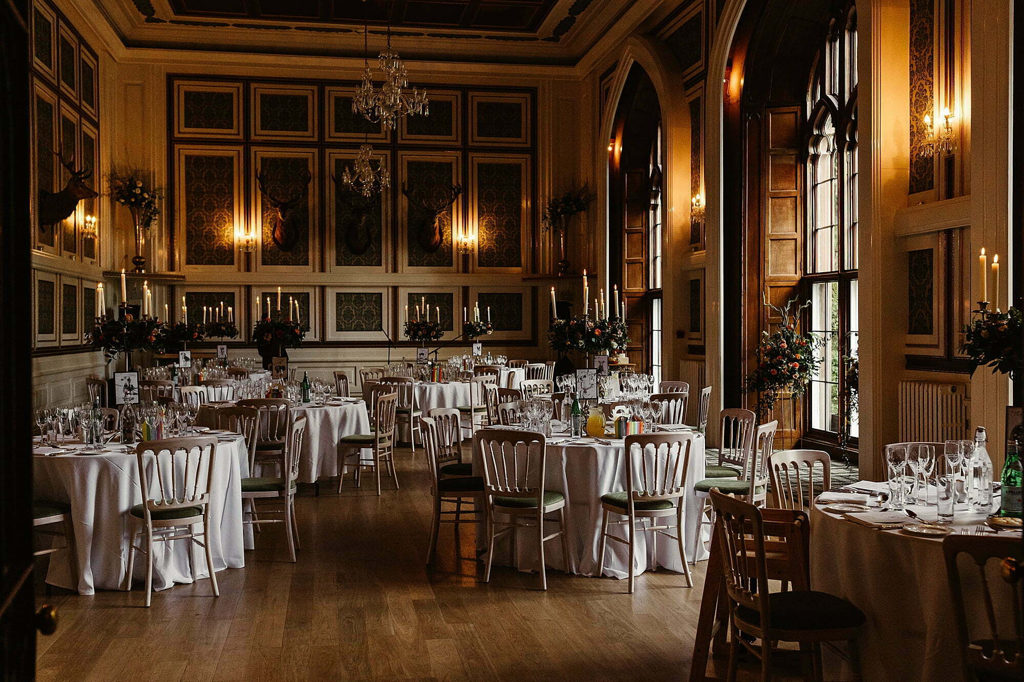drumtochty castle main hall interior inside wedding dinner setup round tables