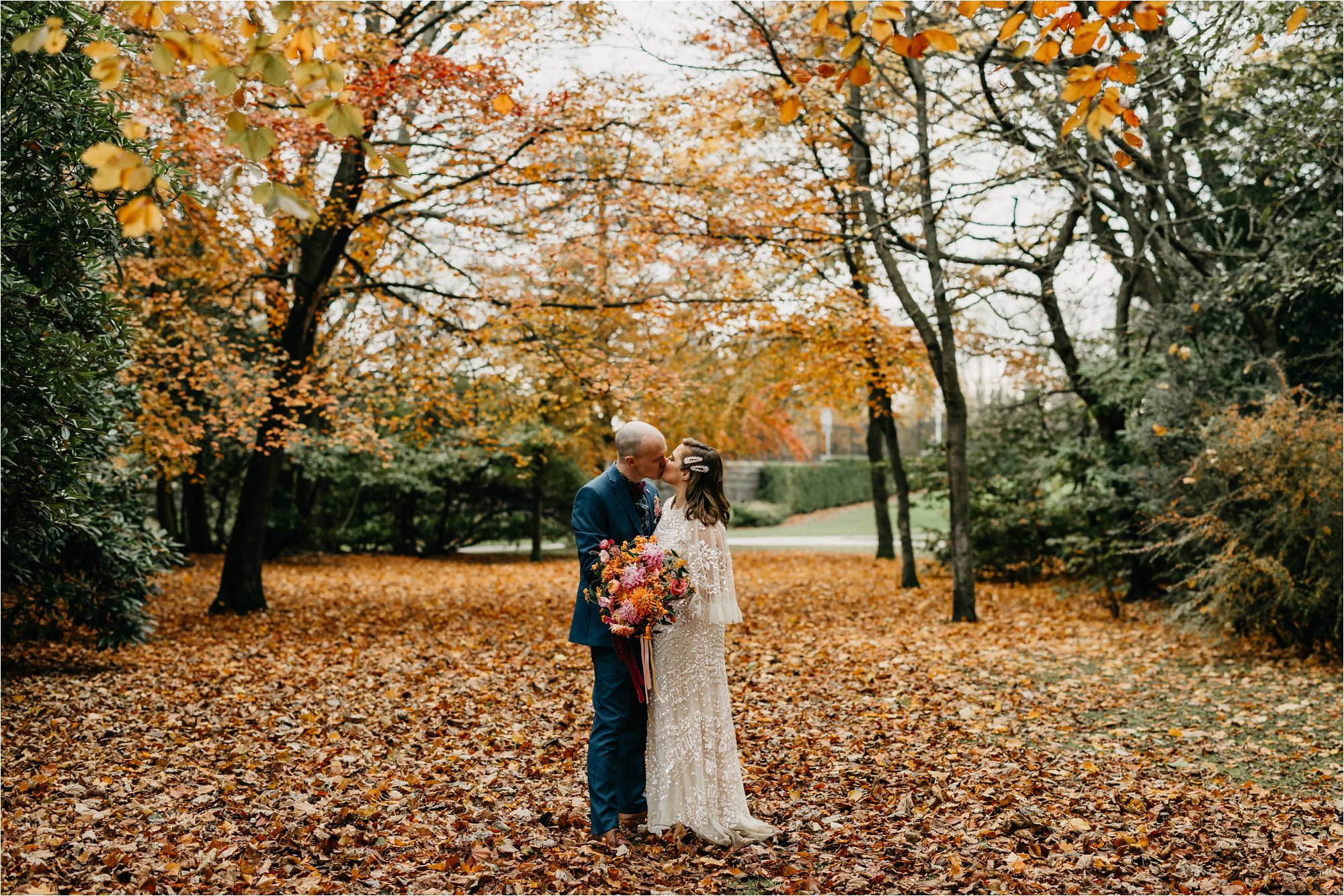 Duthie Park aberdeen micro wedding bride groom portrait in autumn winter leaves colourful