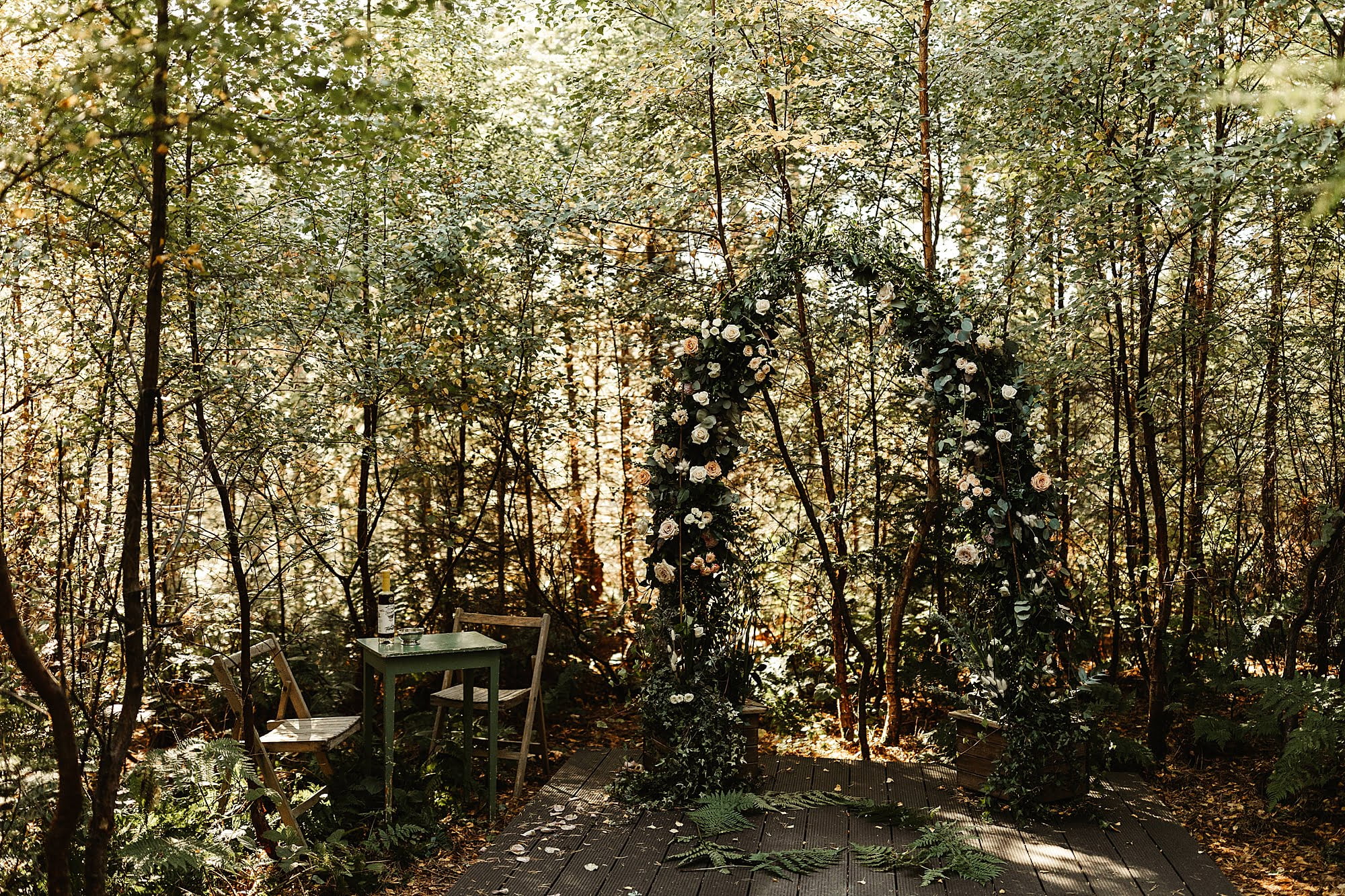 glendye ceremony outside hays flowers arch