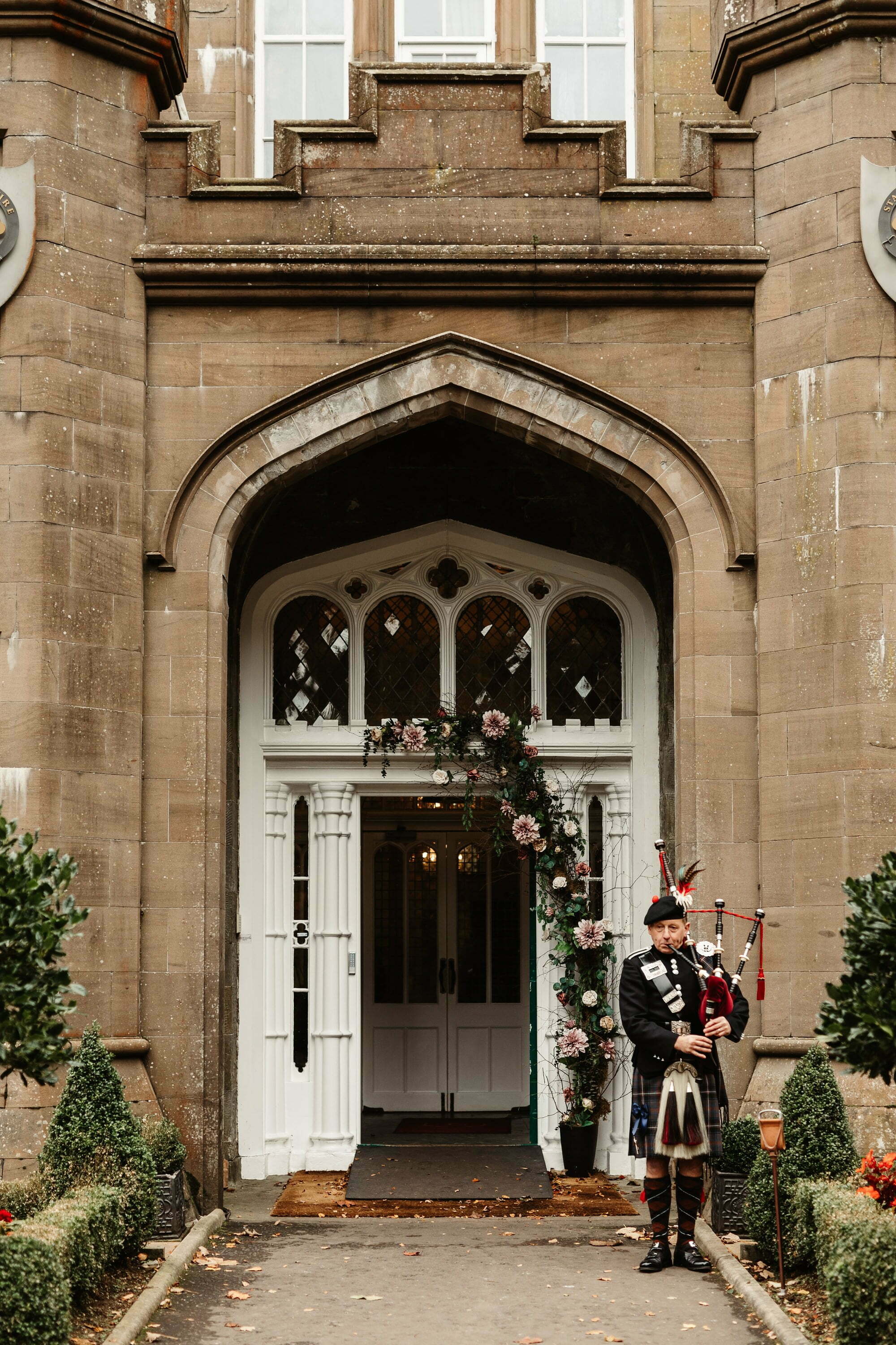 drumtochty castle wedding floral entrance Myrtle and Bracken autumnal piper bagpipes