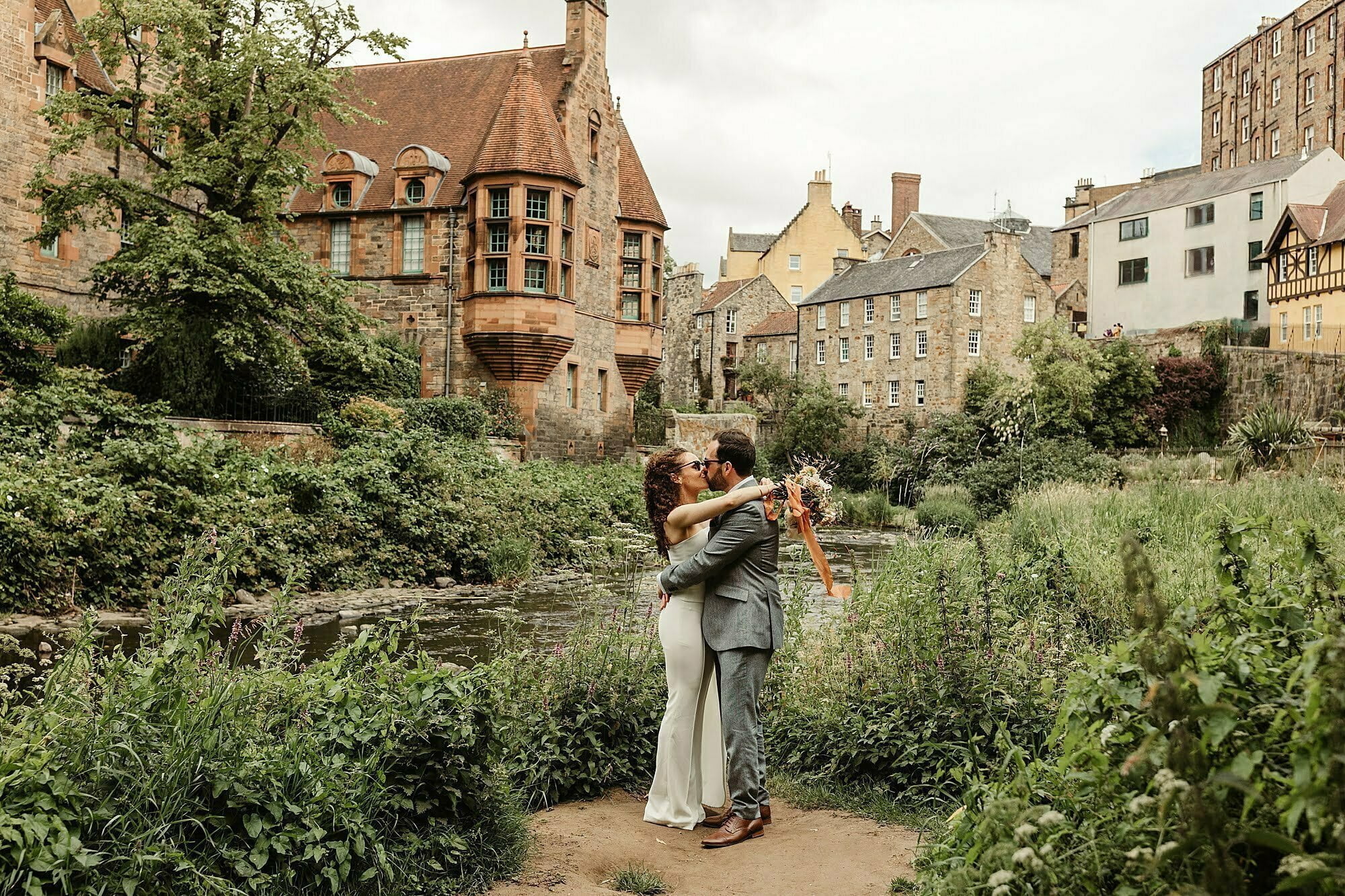 bride and groom bride in Nadine Merabi trouser suit white dean village edinburgh elopement modern wedding photography