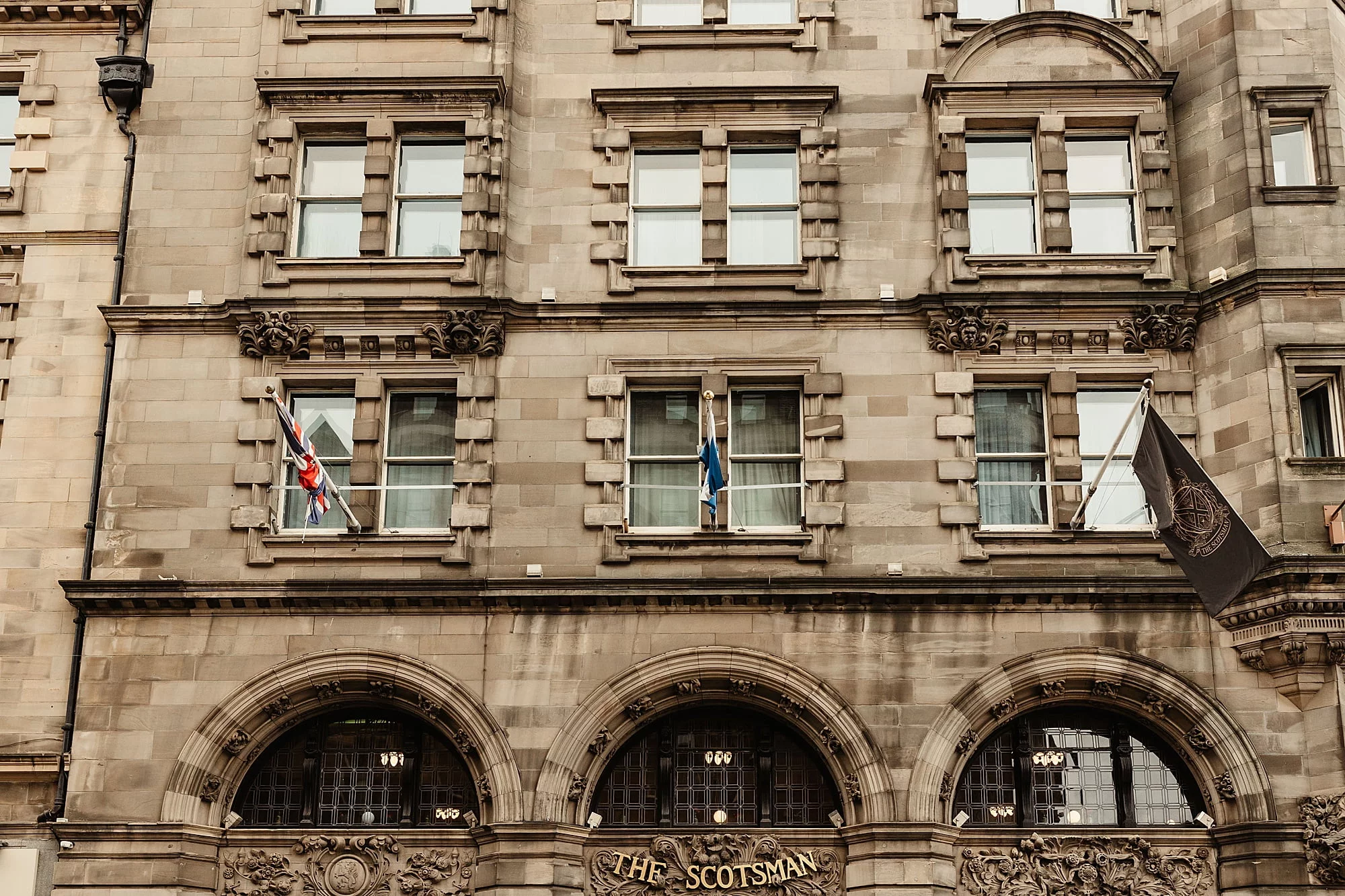 The scotsman hotel exterior outside edinburgh flags