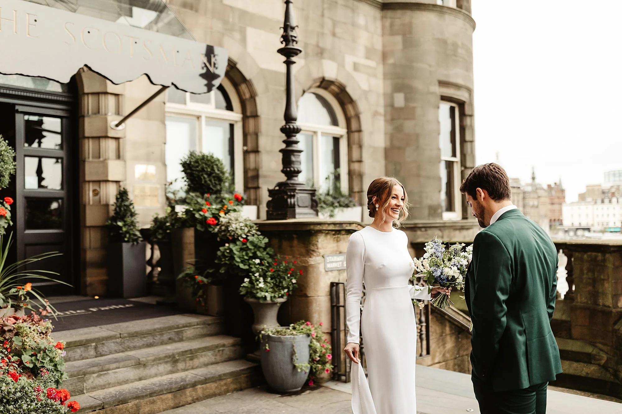 the scotsman hotel micro wedding Narcissus Flowers bouquet Park and Fifth Co dress bride and groom first look