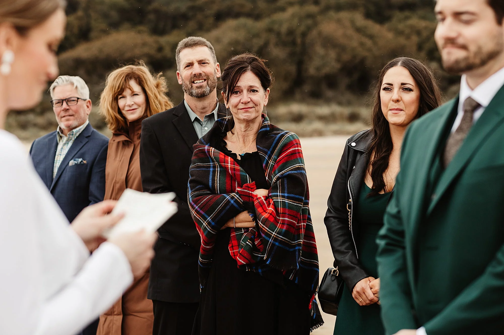 seacliff beach micro wedding ceremony spot scenery view bride and groom emotional family tartan blanket