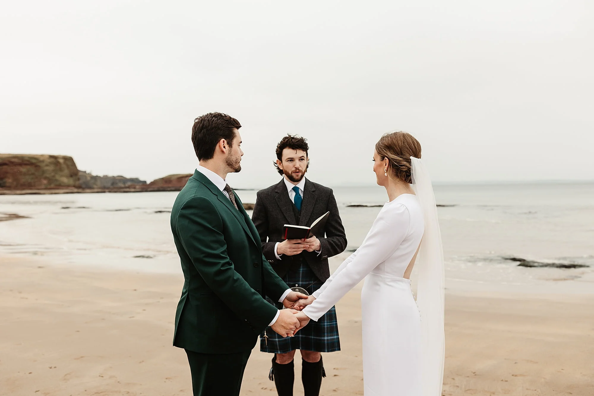 seacliff beach micro wedding ceremony bride and groom Park and Fifth Co dress