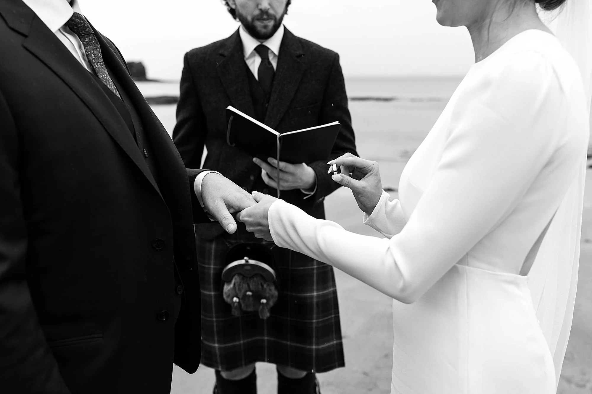 seacliff beach micro wedding ceremony bride and groom Park and Fifth Co dress ring exchange