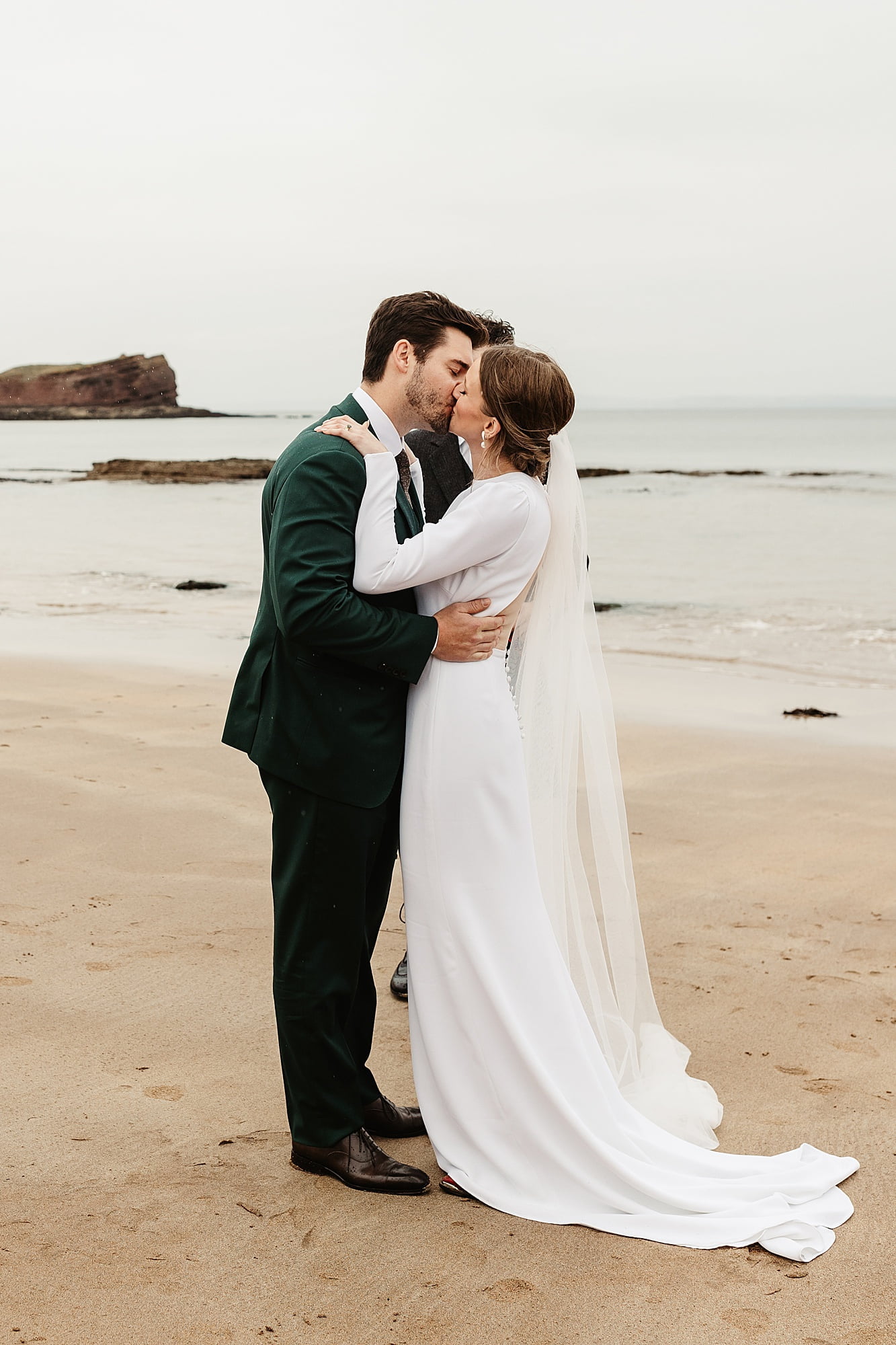 seacliff beach micro wedding ceremony bride and groom Park and Fifth Co dress first kiss