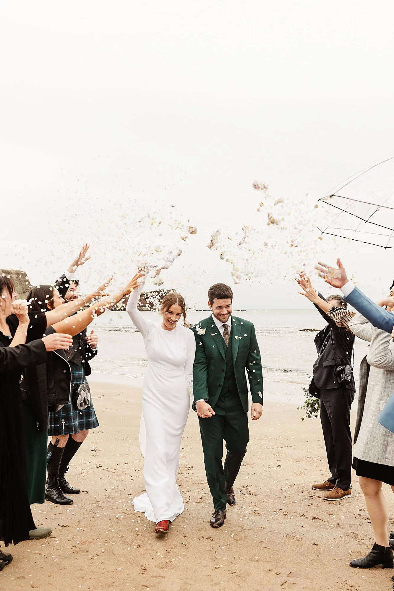 seacliff beach micro wedding ceremony confetti throw bride and groom Park and Fifth Co wedding dress