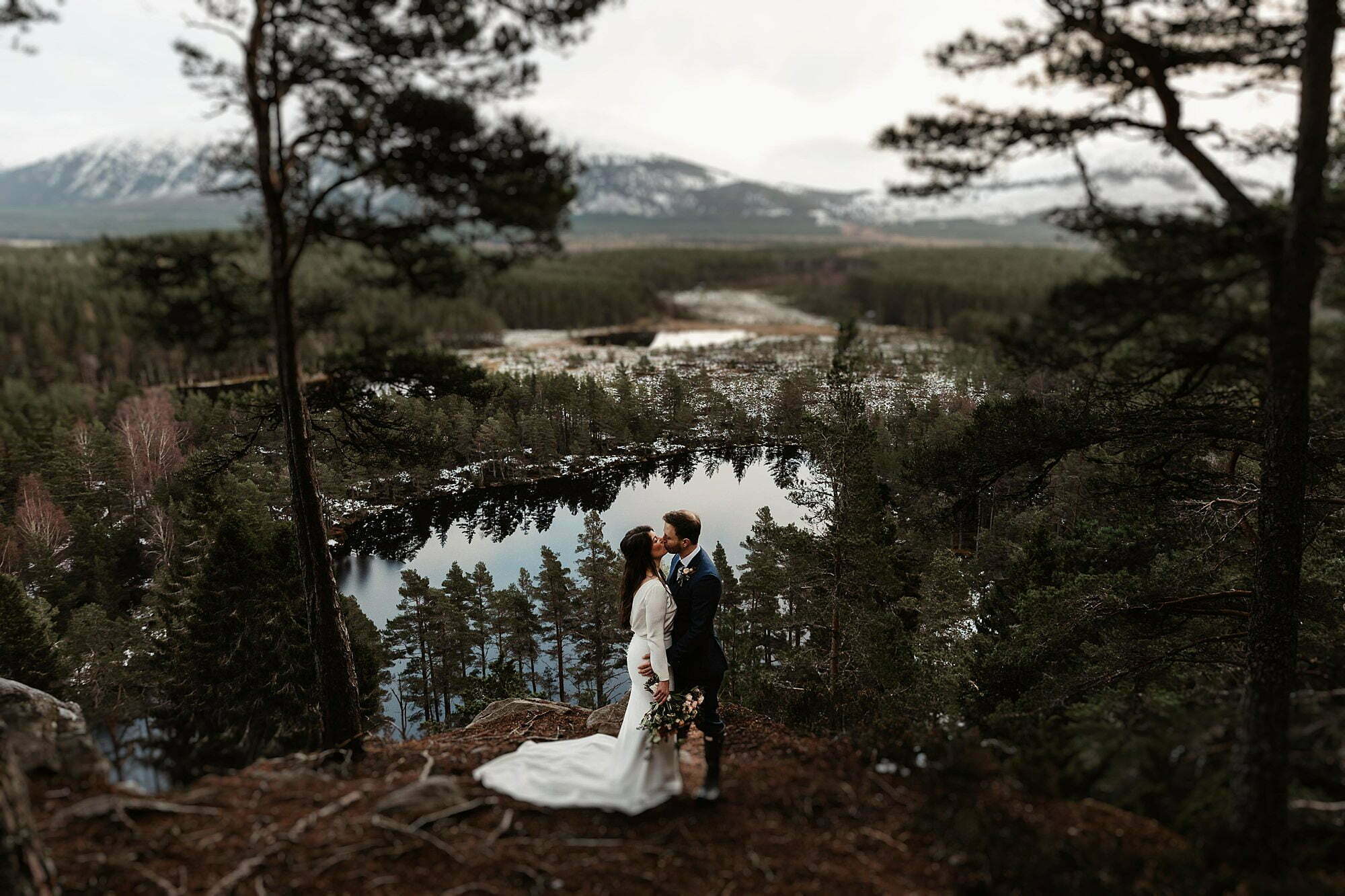 Cairngorms national park evergreen trees loch insh views bride groom portrait