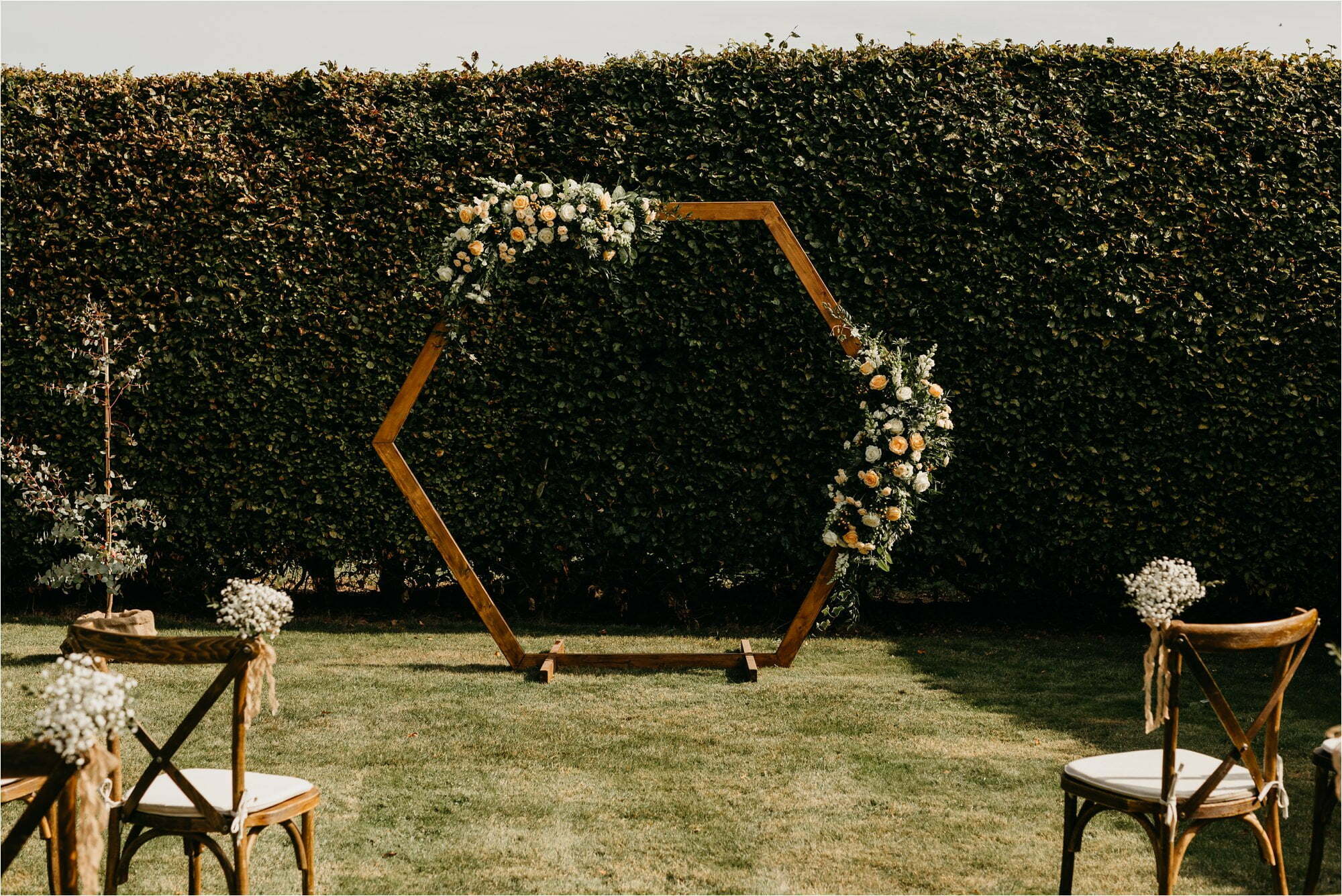 farm micro wedding scottish borders bride groom marriage ceremony with luxury event styling scotland hexagonal wooden backdrop