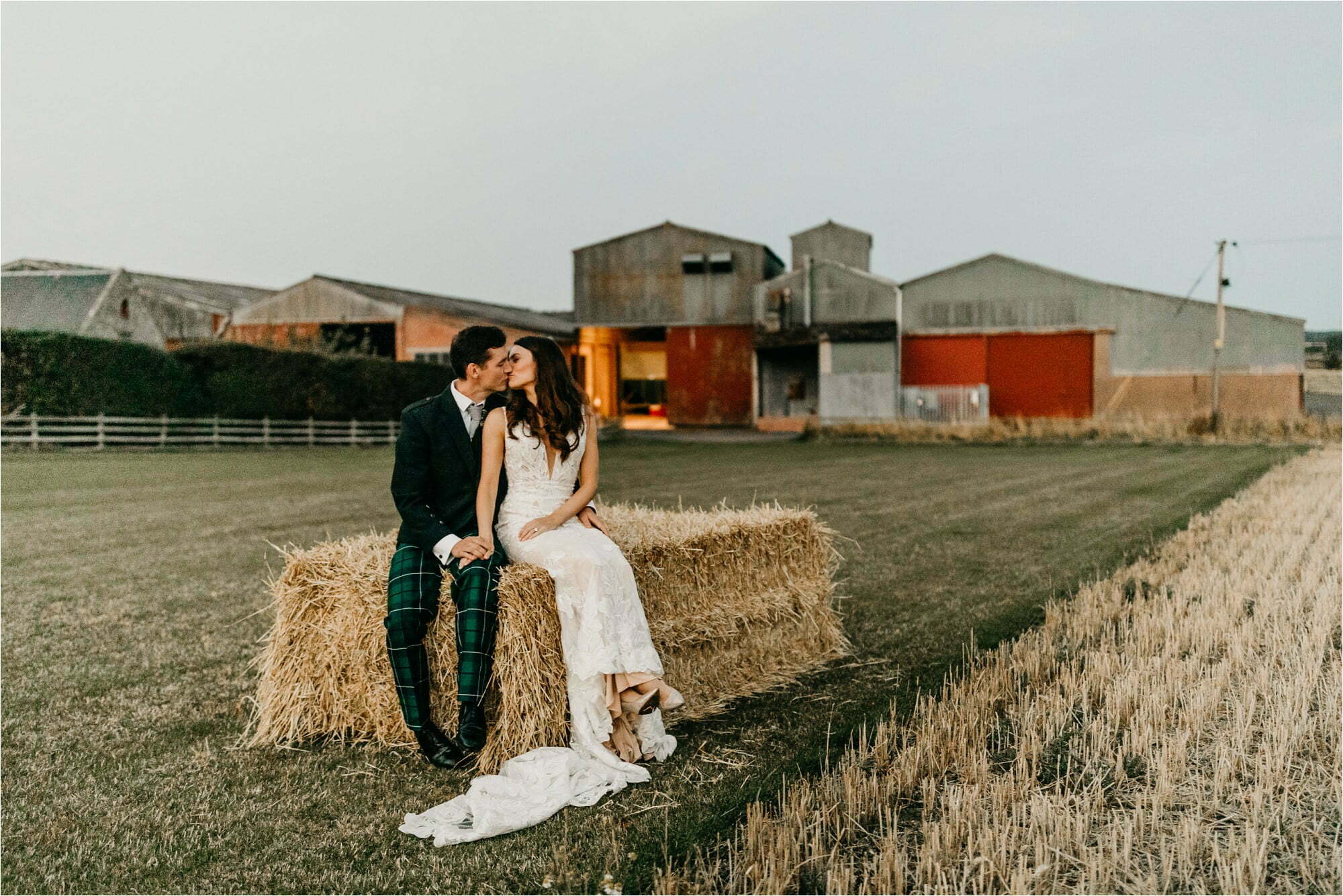 farm micro wedding scottish borders sunset photos bride groom portraits on hay bales