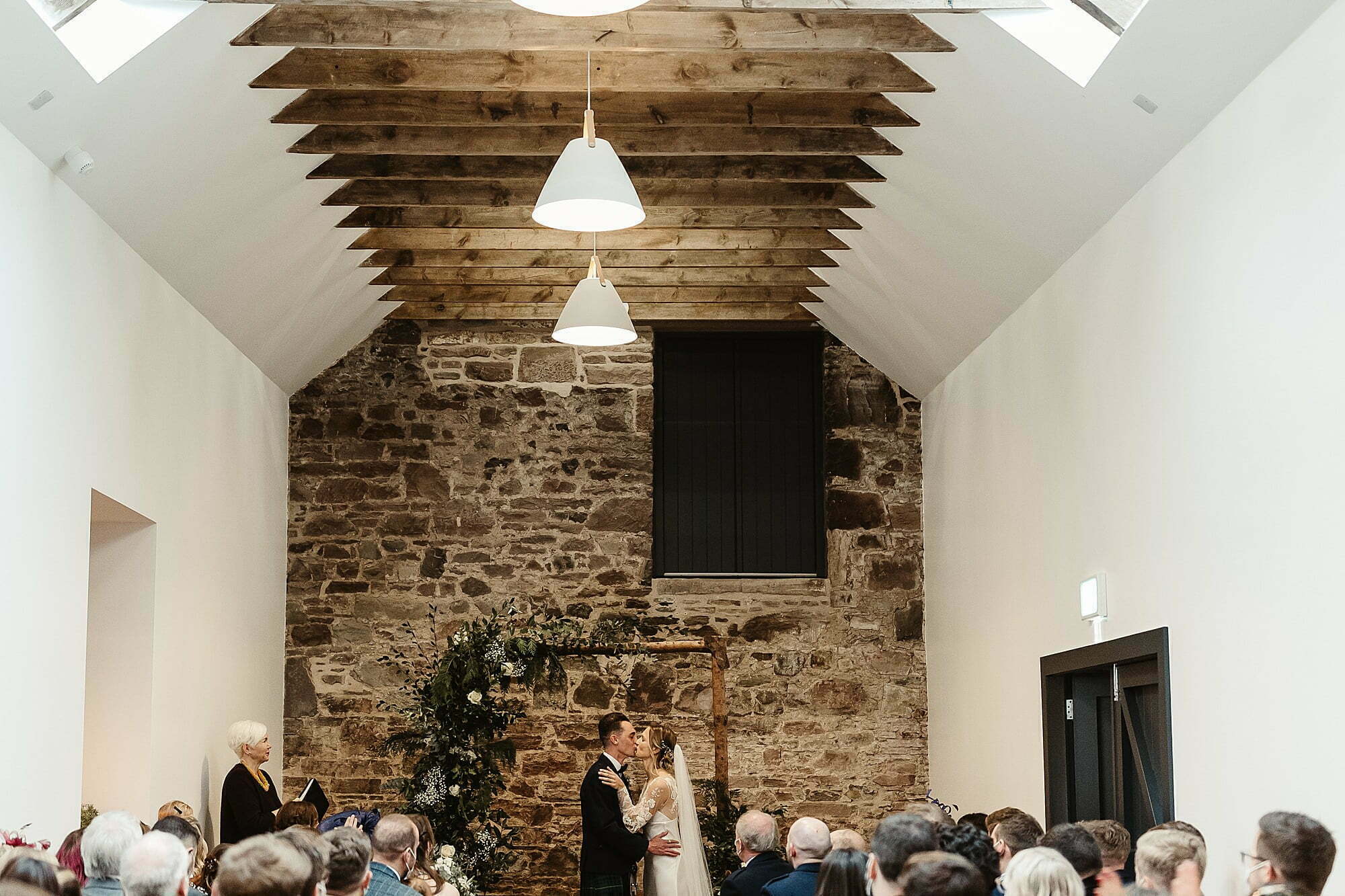 guardswell farm winter wedding first kiss bride and groom ceremony