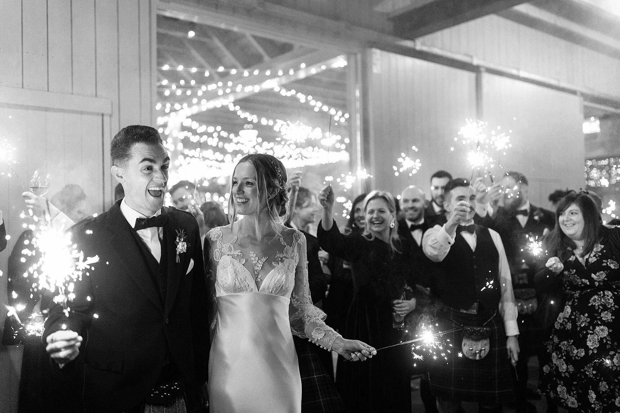 guardswell farm winter wedding bride groom sparkler portrait