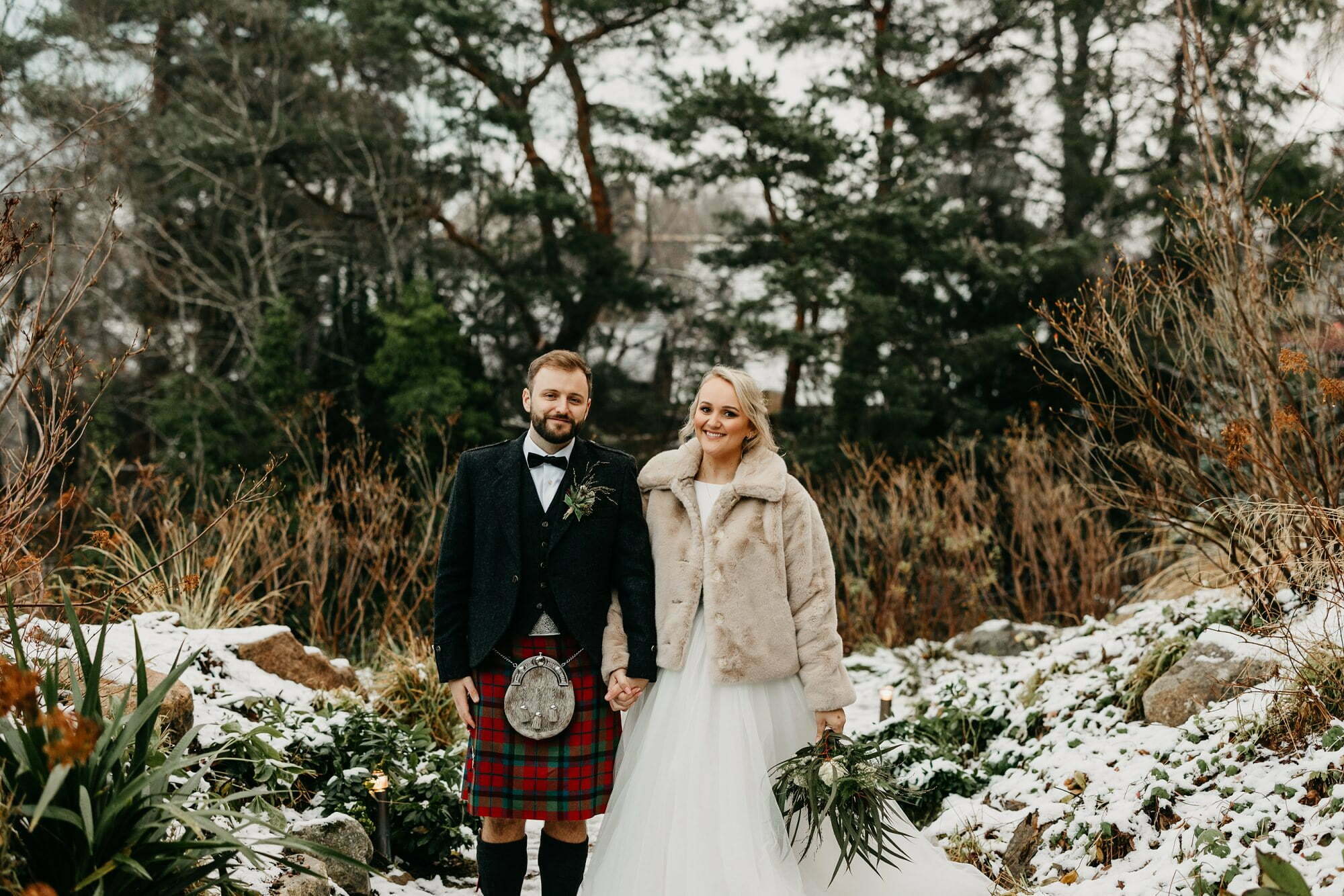 fife arms hotel braemar wedding bride groom portraits in snow by river clunie water