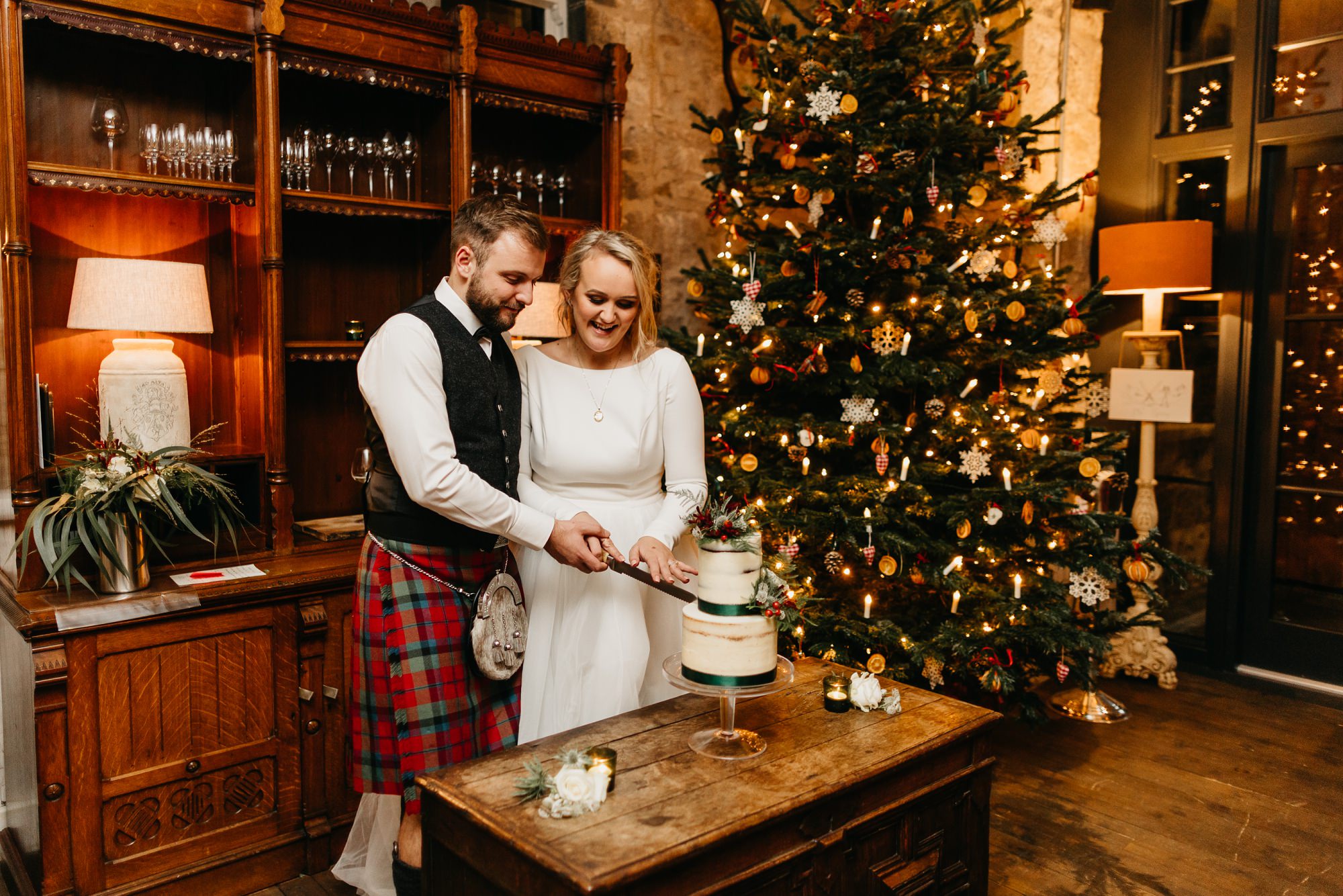 fife arms hotel braemar wedding bride groom cutting cake