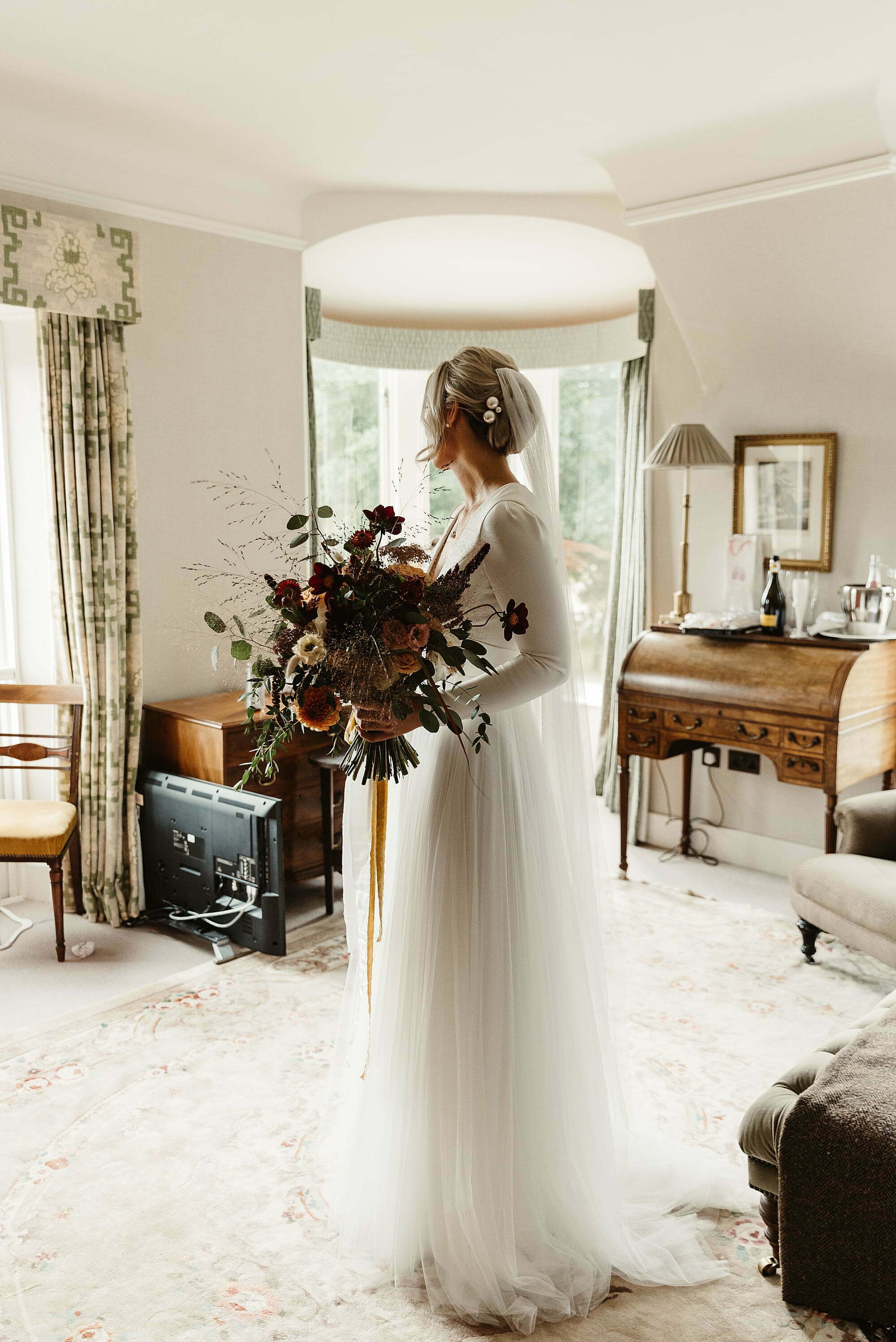 coos cathedral autumnal wedding bride portrait sassi holford dress gloam flowers bouquet