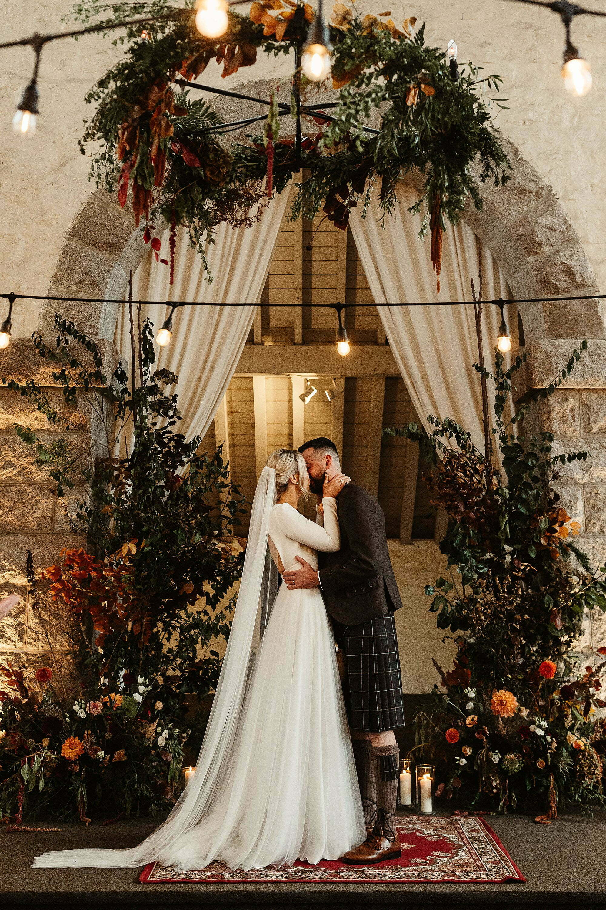 coos cathedral autumnal wedding floral backdrop ceremony gloam first kiss