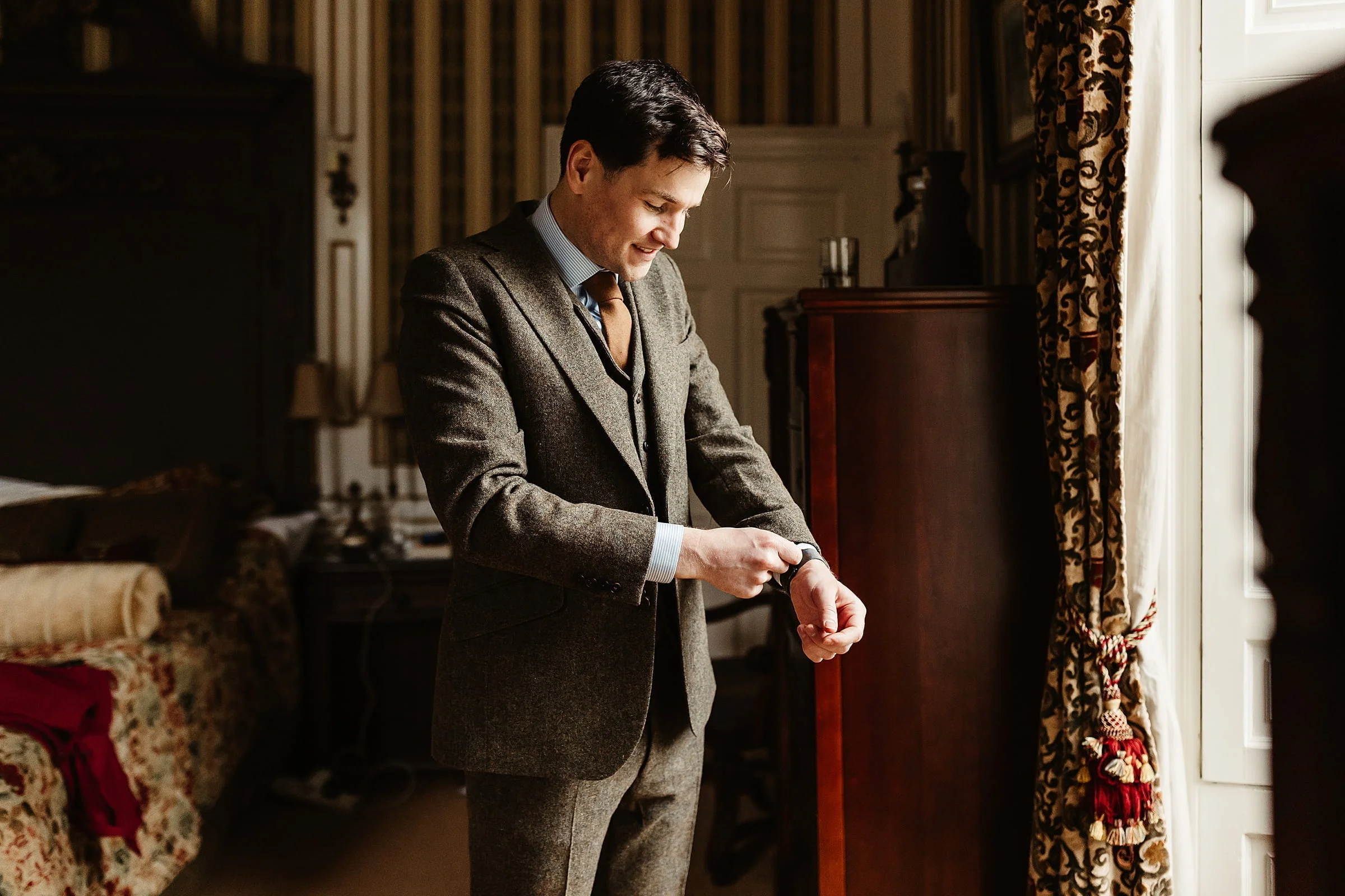 drumtochty castle groom getting ready portrait walker slater suit brown tweed