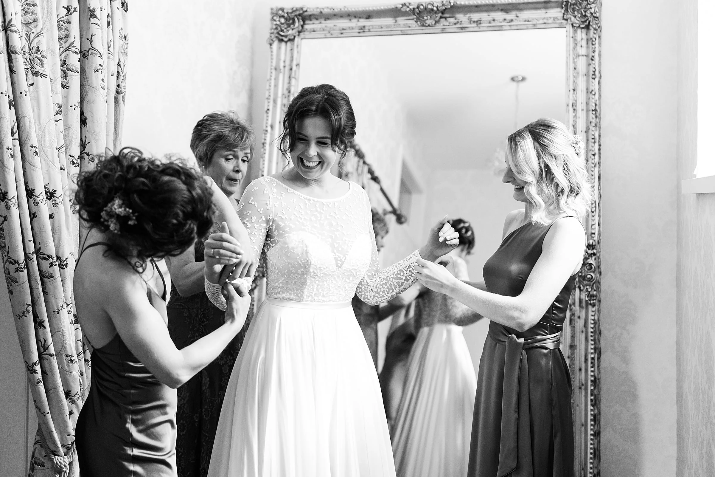 drumtochty castle bride getting dressed Sassi Holford dress bridesmaids helping