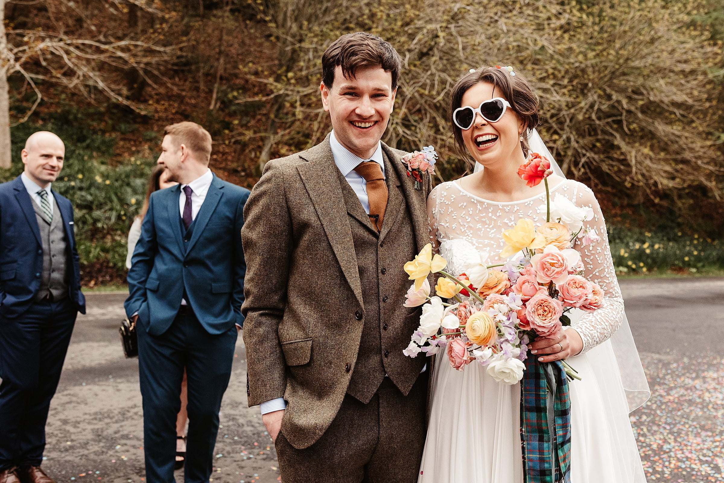 drumtochty castle drinks reception outdoors bride and groom walker slater suit