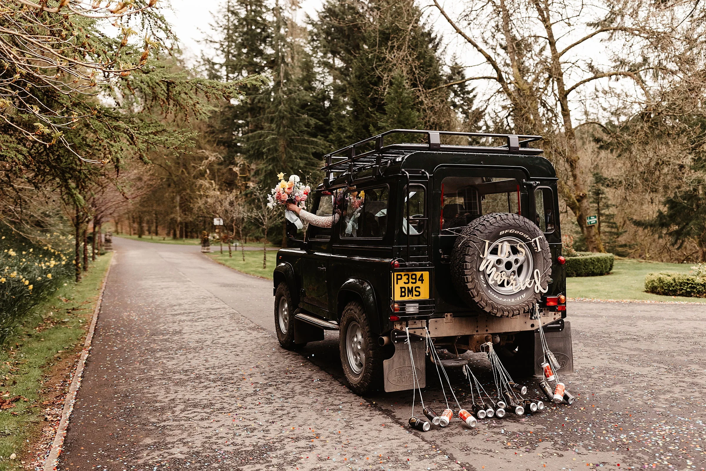 Drumtochty castle wedding photos landrover wedding car exit