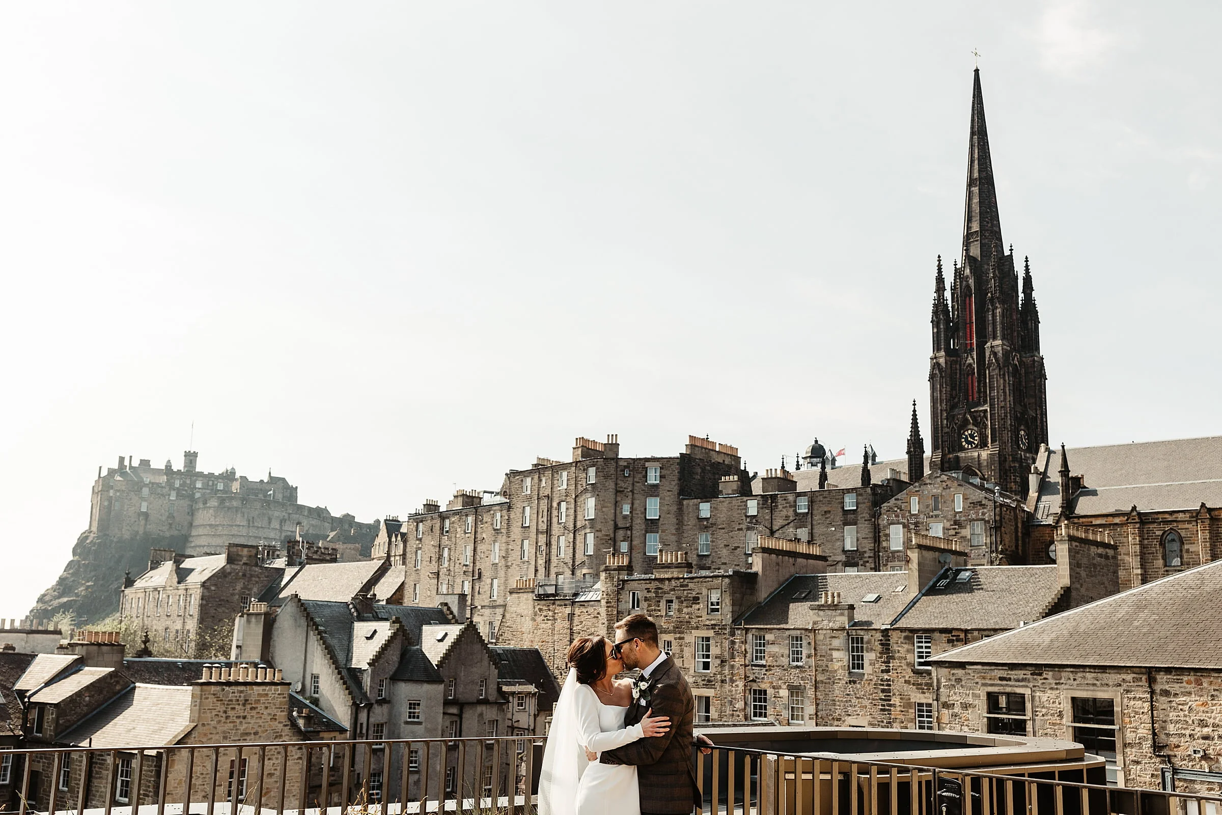 virgin hotels edinburgh rooftop bride and groom photo edinburgh castle view