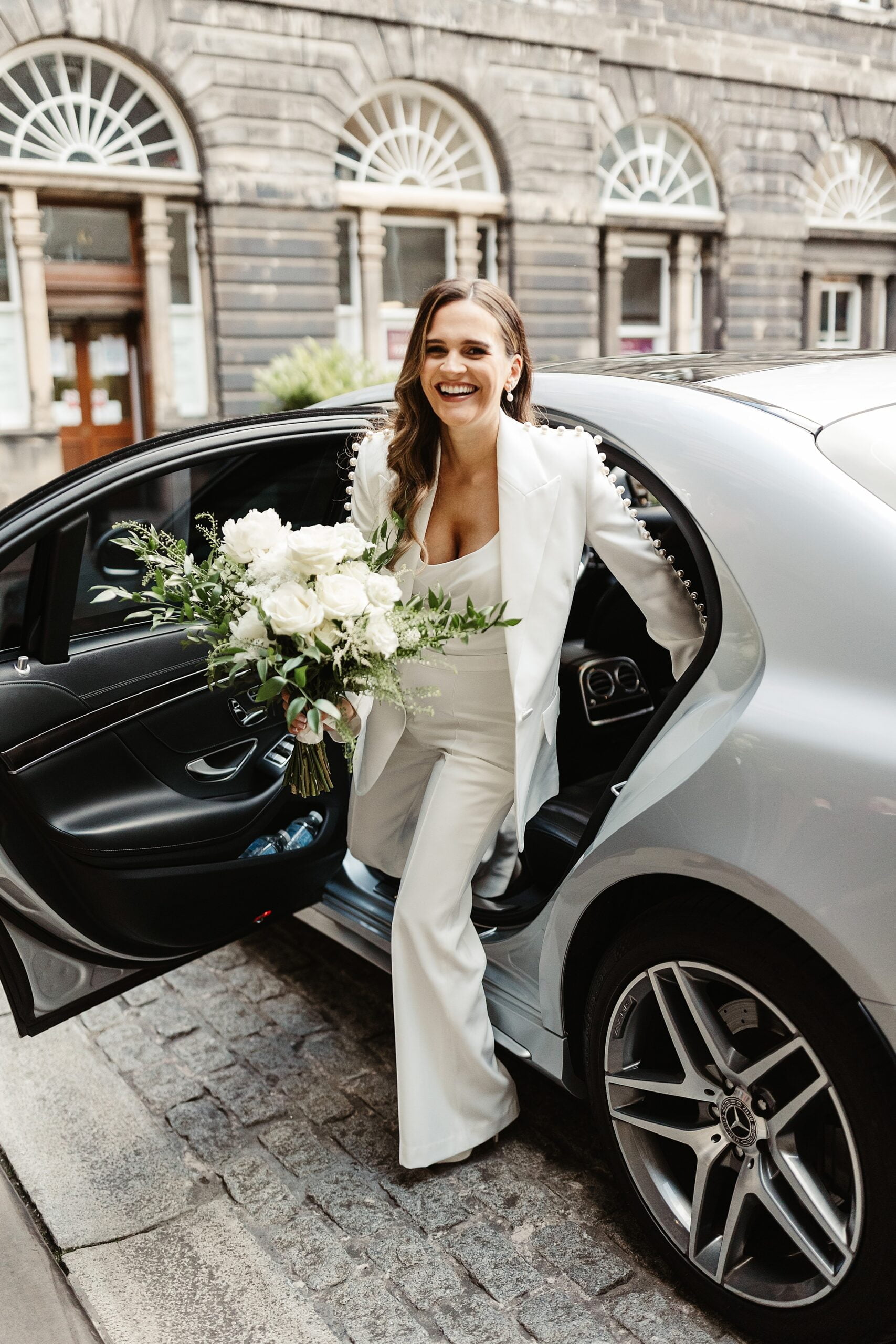 bride arriving at edinburgh city chambers Nadine Merabi trouser suit