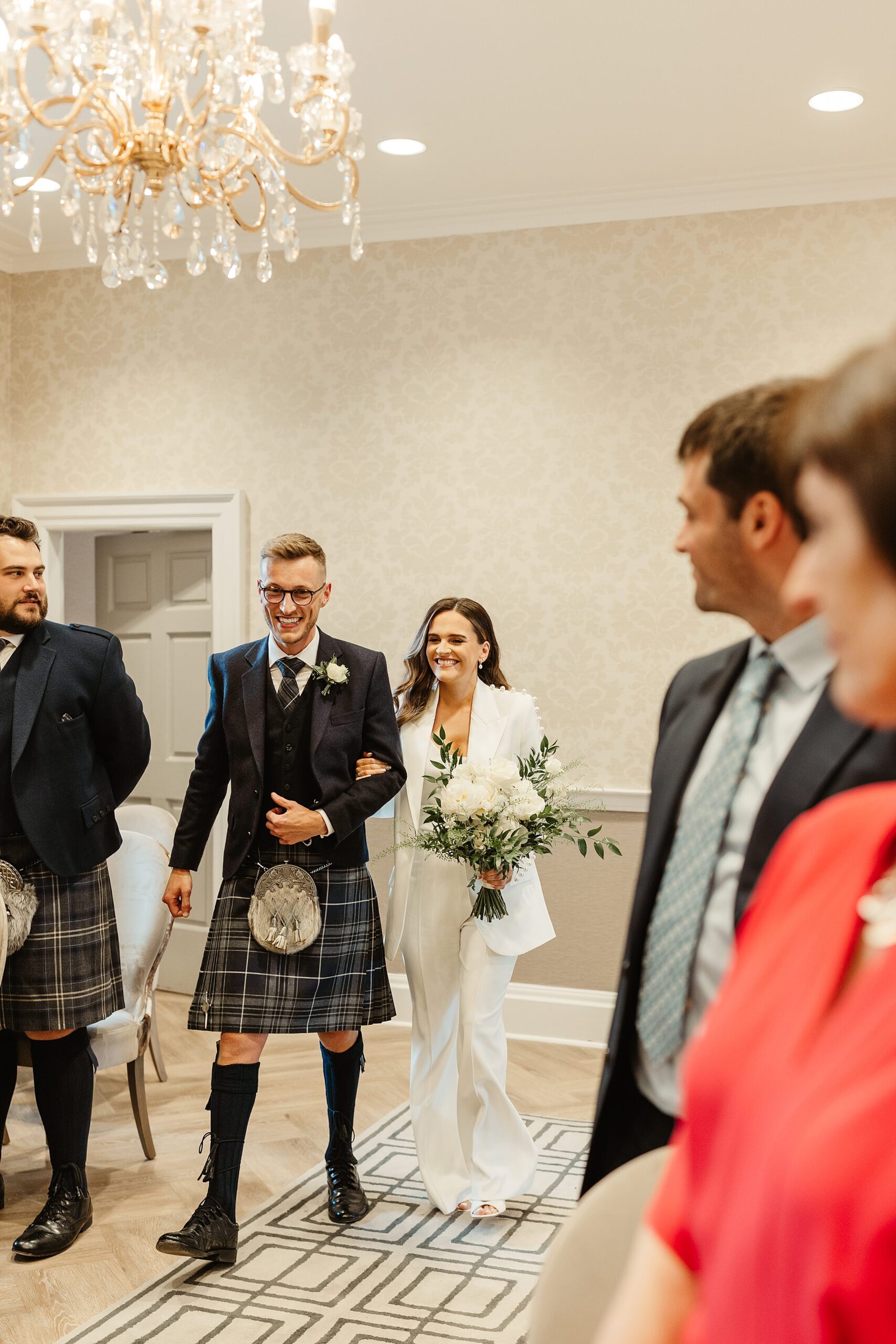 bride and groom walking down the aisle edinburgh city chambers elopement