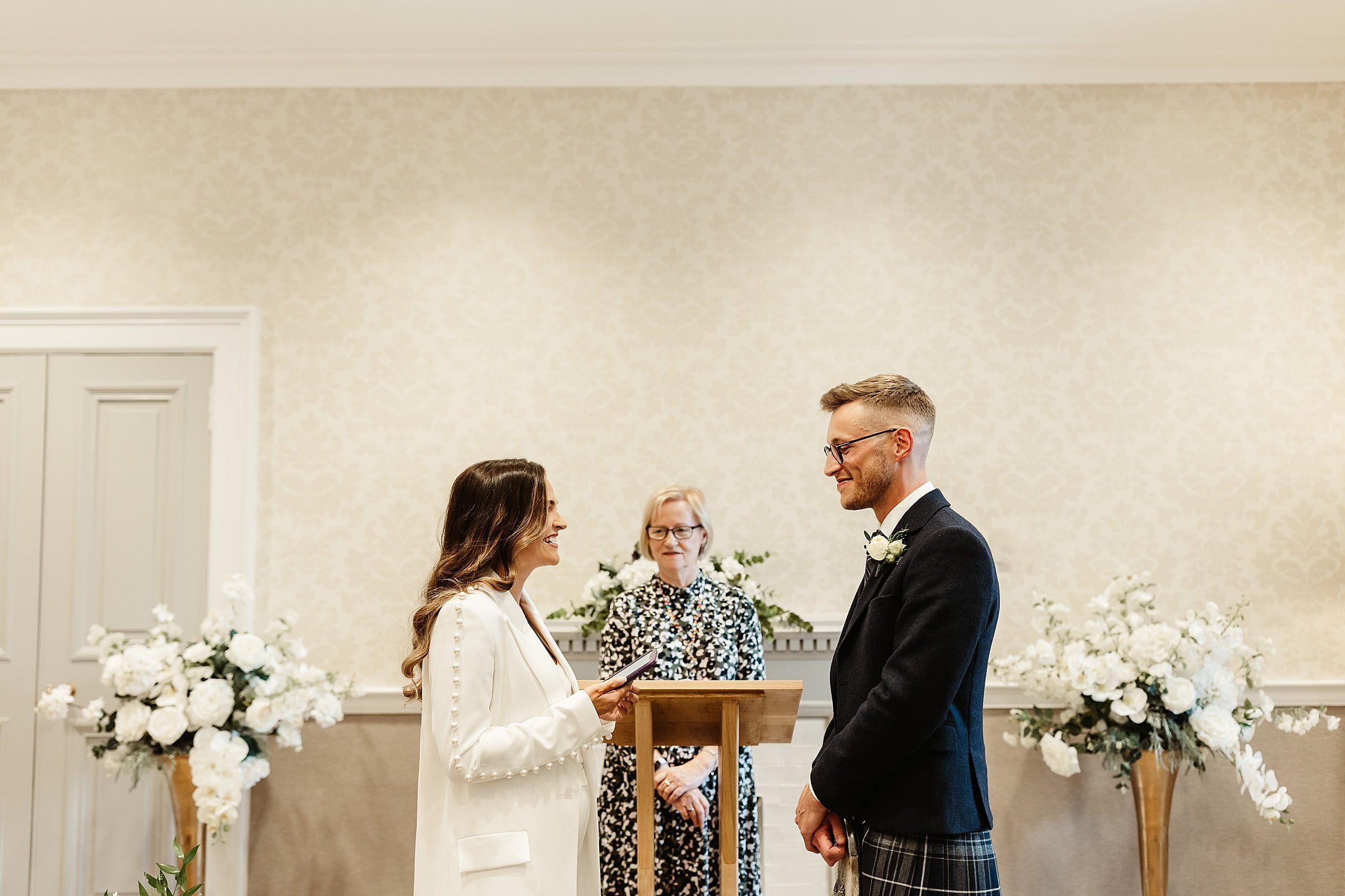 bride and groom ceremony room edinburgh city chambers elopement