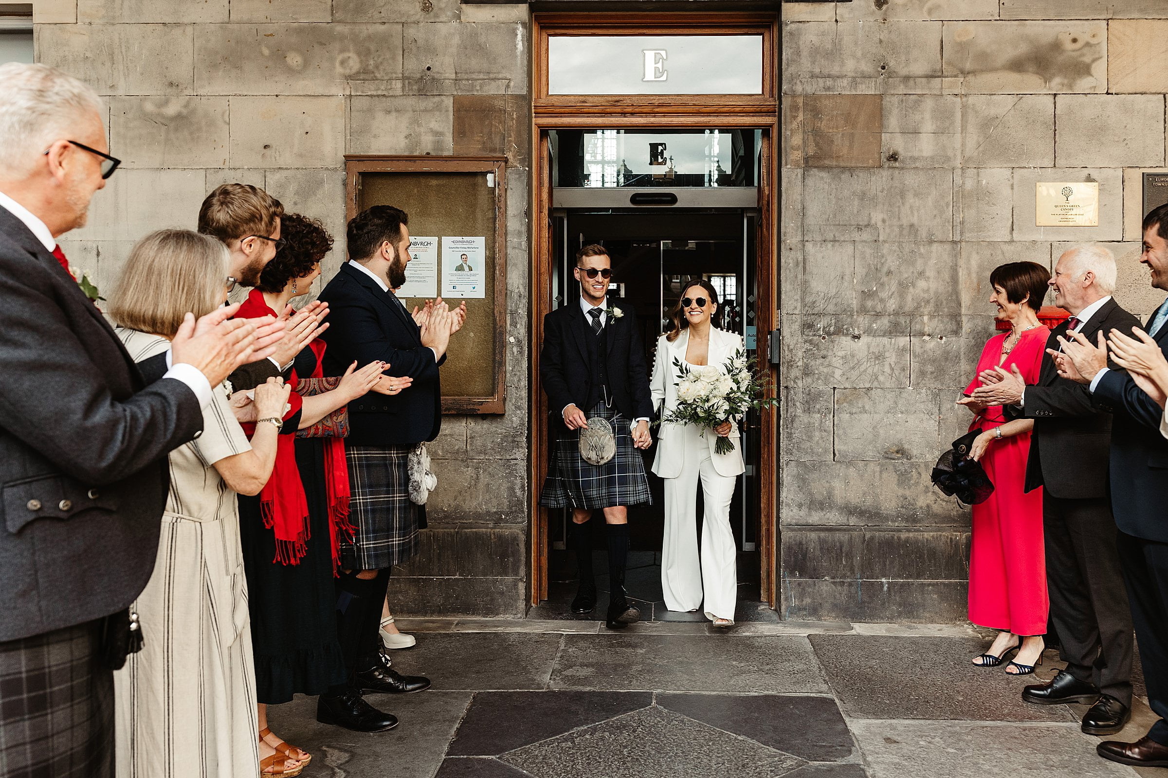 Edinburgh city chambers elopement bride and groom exit Nadine Merabi trouser suit