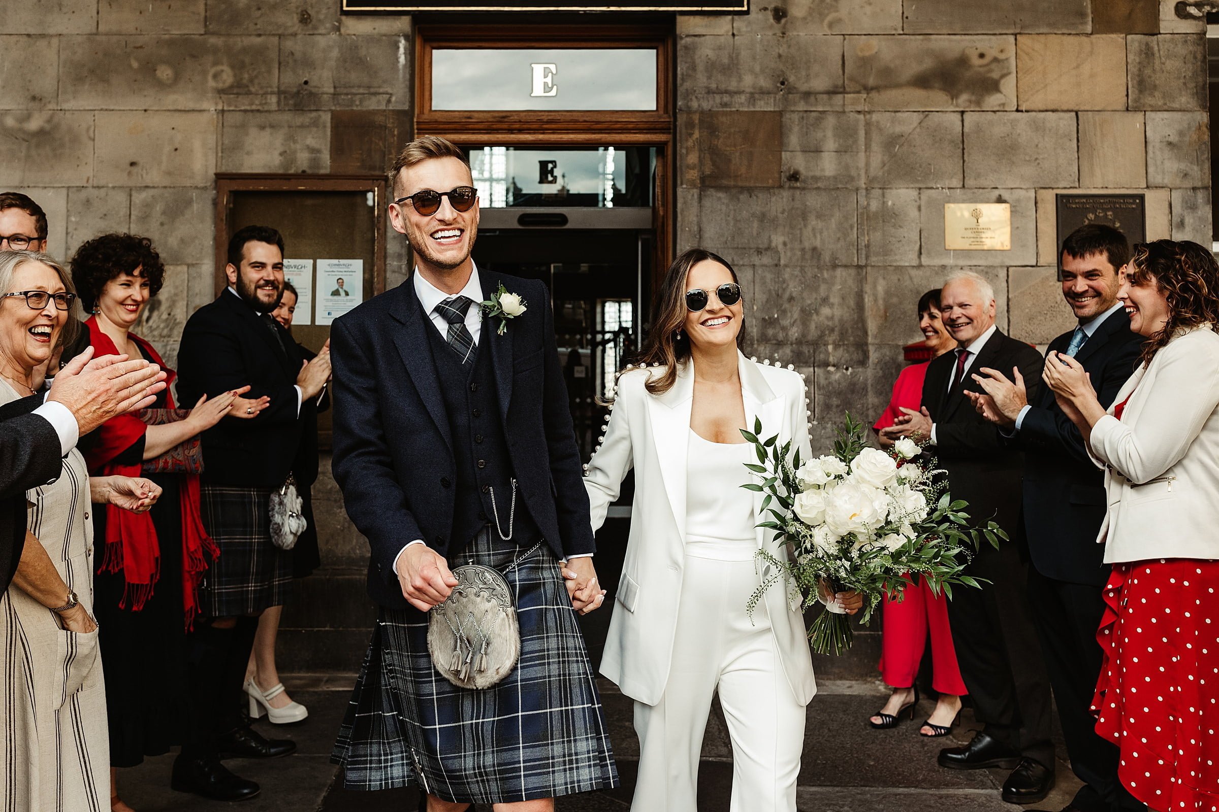 Edinburgh city chambers elopement bride and groom exit Nadine Merabi trouser suit