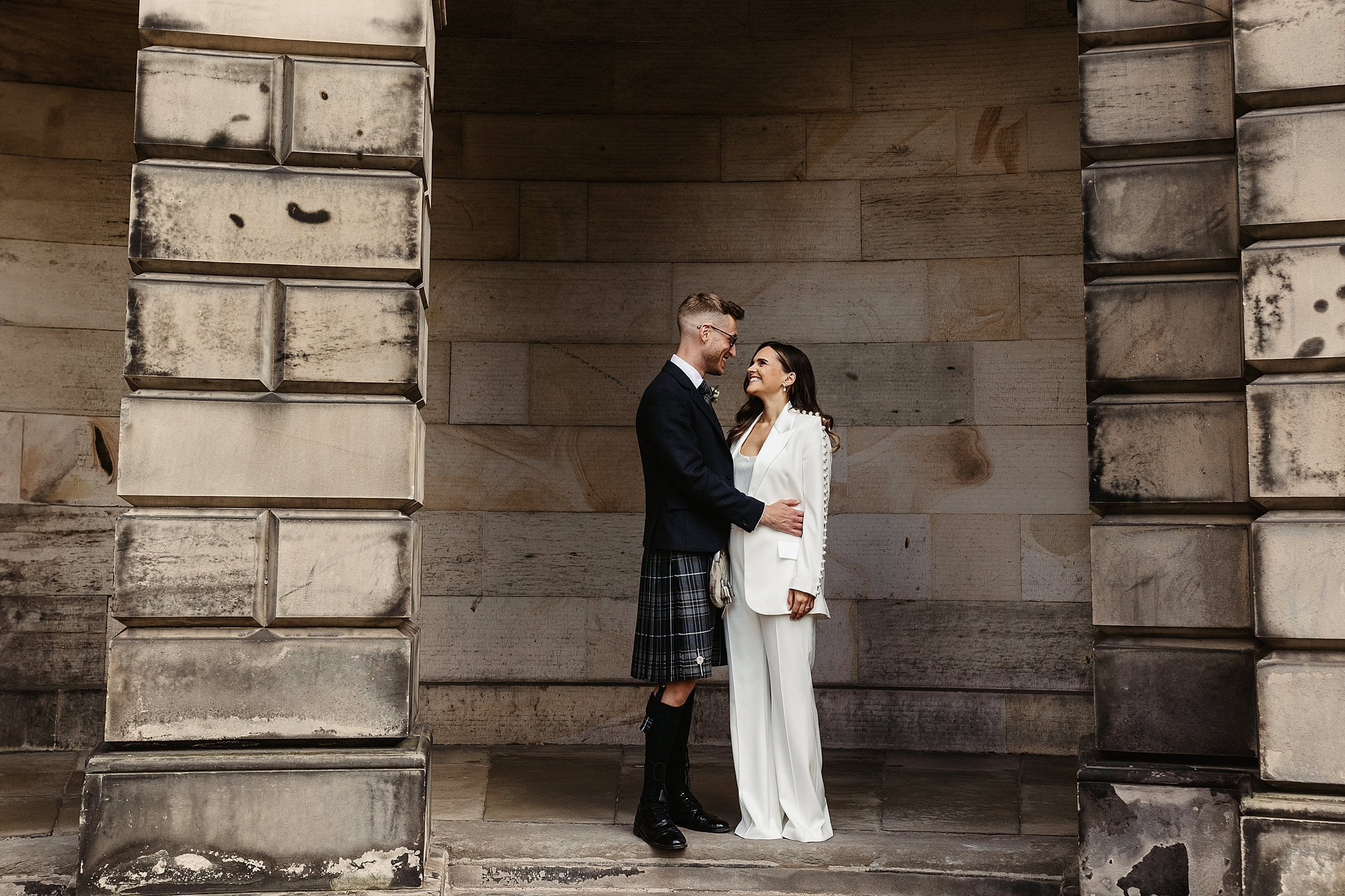 Edinburgh city chambers elopement photography bride and groom portrait Nadine Merabi trouser suit