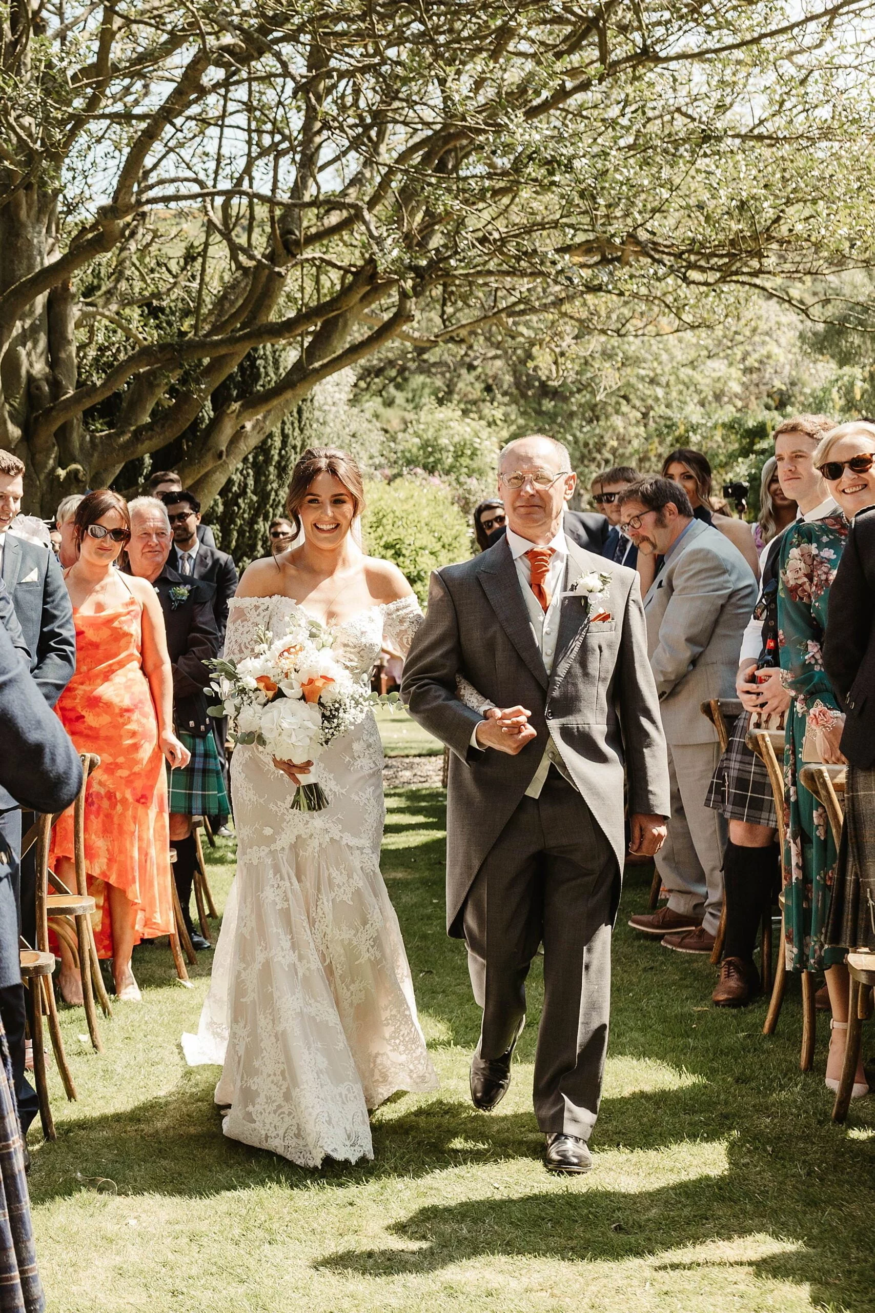 woodwrae farm wedding bride walking down the aisle with dad marrime wedding dress bloom florals bouquet