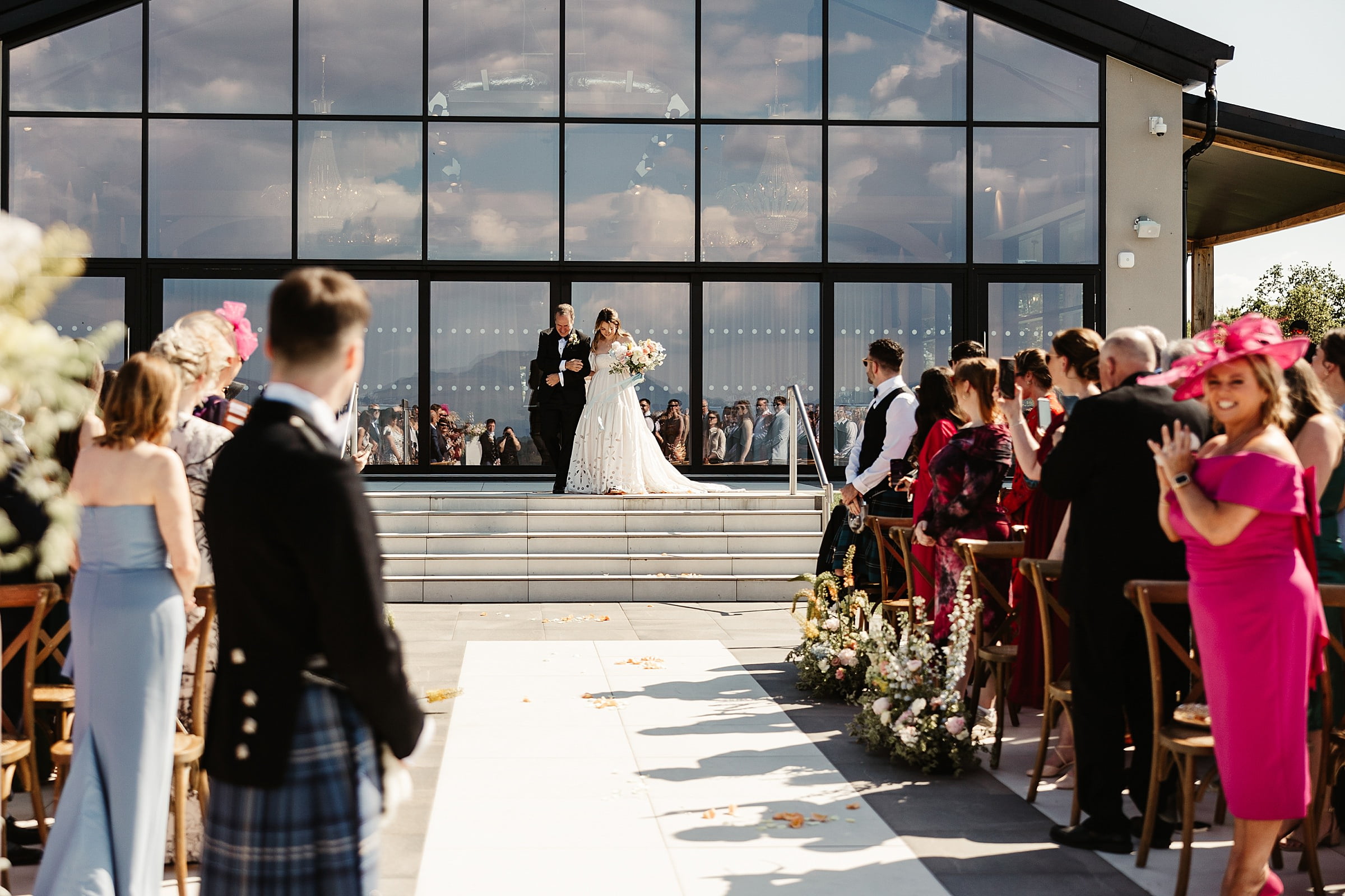 boturich castle wedding ceremony outdoors bride and father walking down the aisle