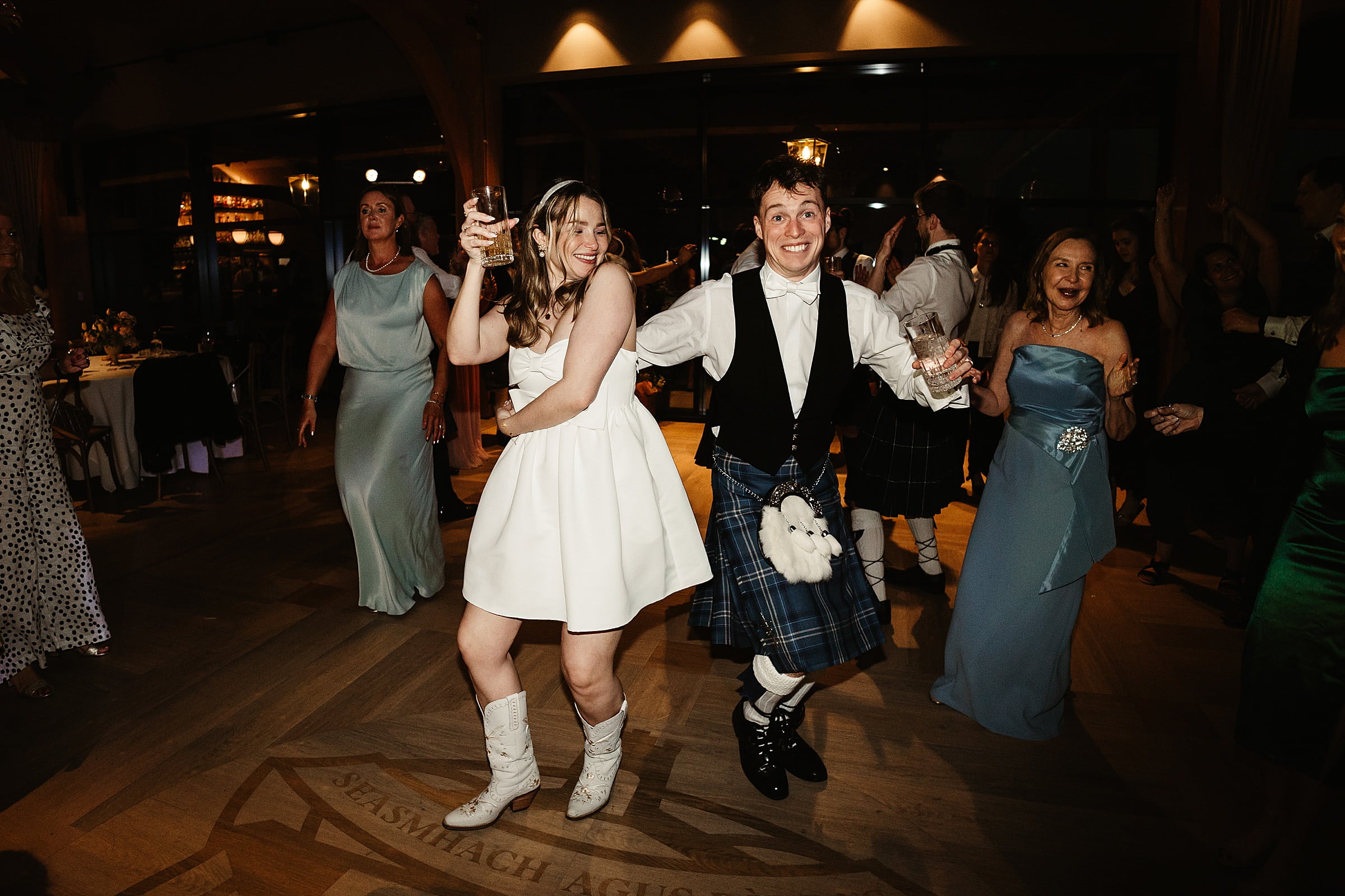 boturich castle wedding photography evening dancing bride in white cowboy boots