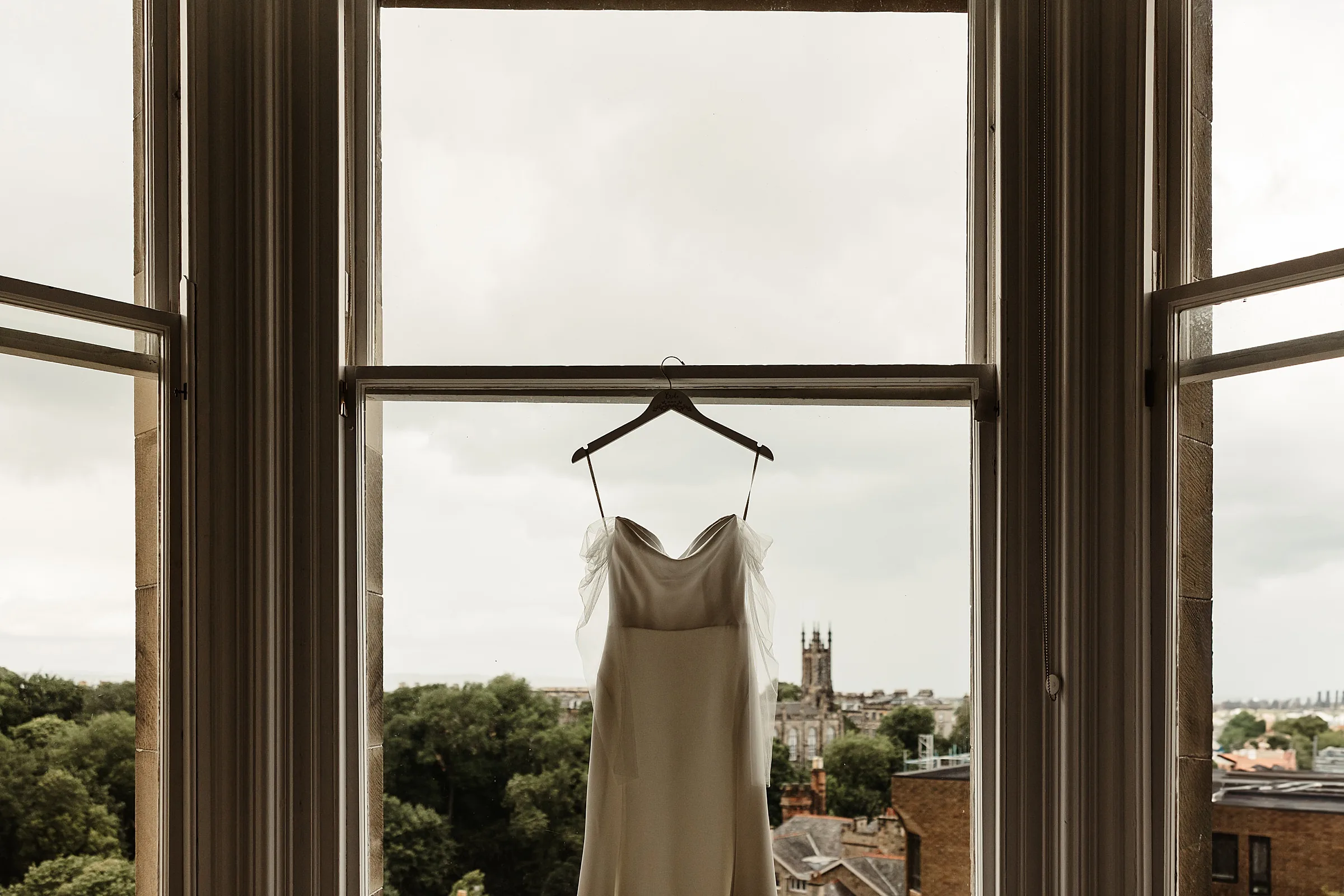 the bonham hotel edinburgh view jenny yoo wedding dress hanging in the window