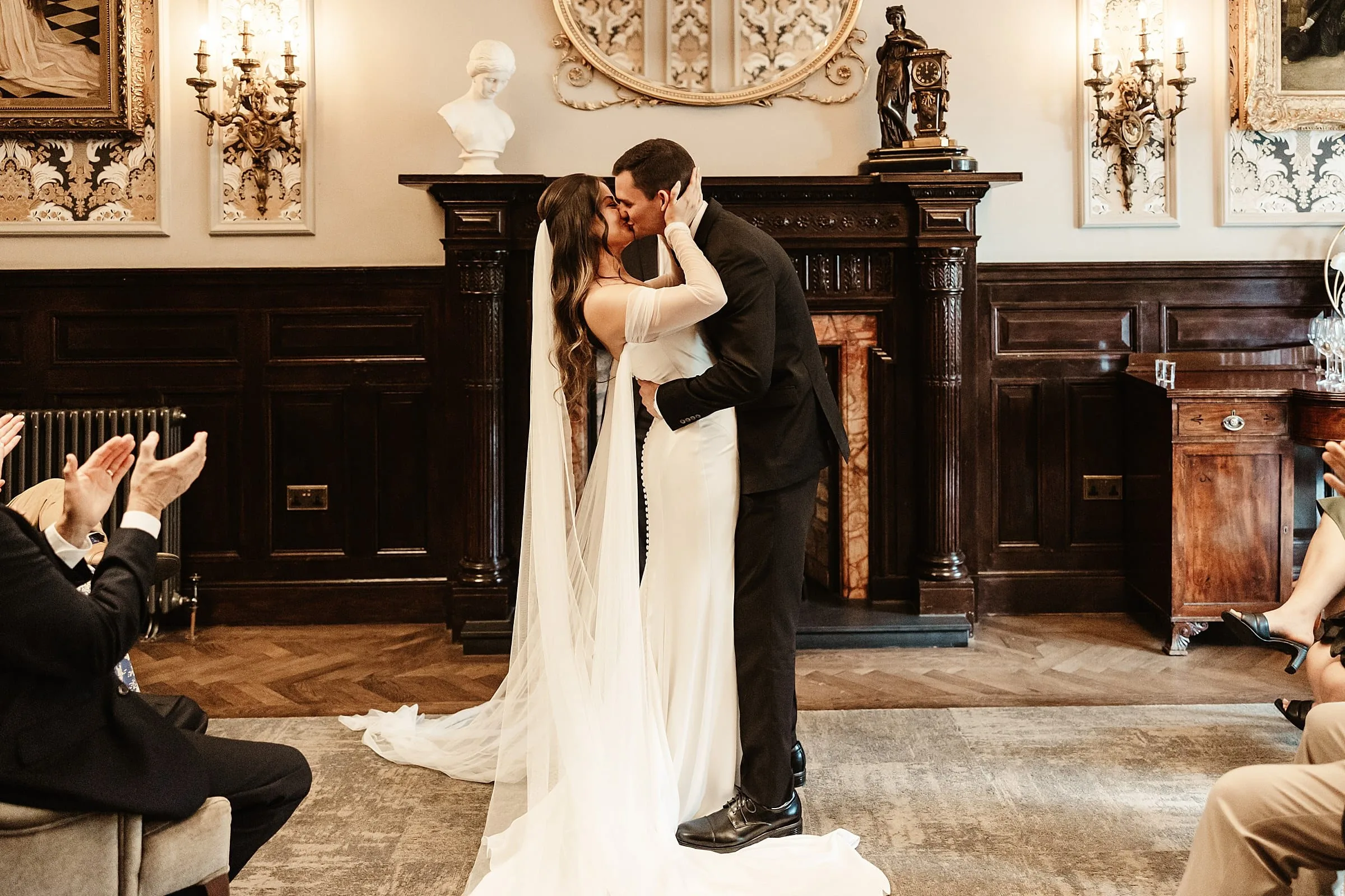 wedding ceremony indoors at the bonham hotel edinburgh intimate first kiss bride and groom