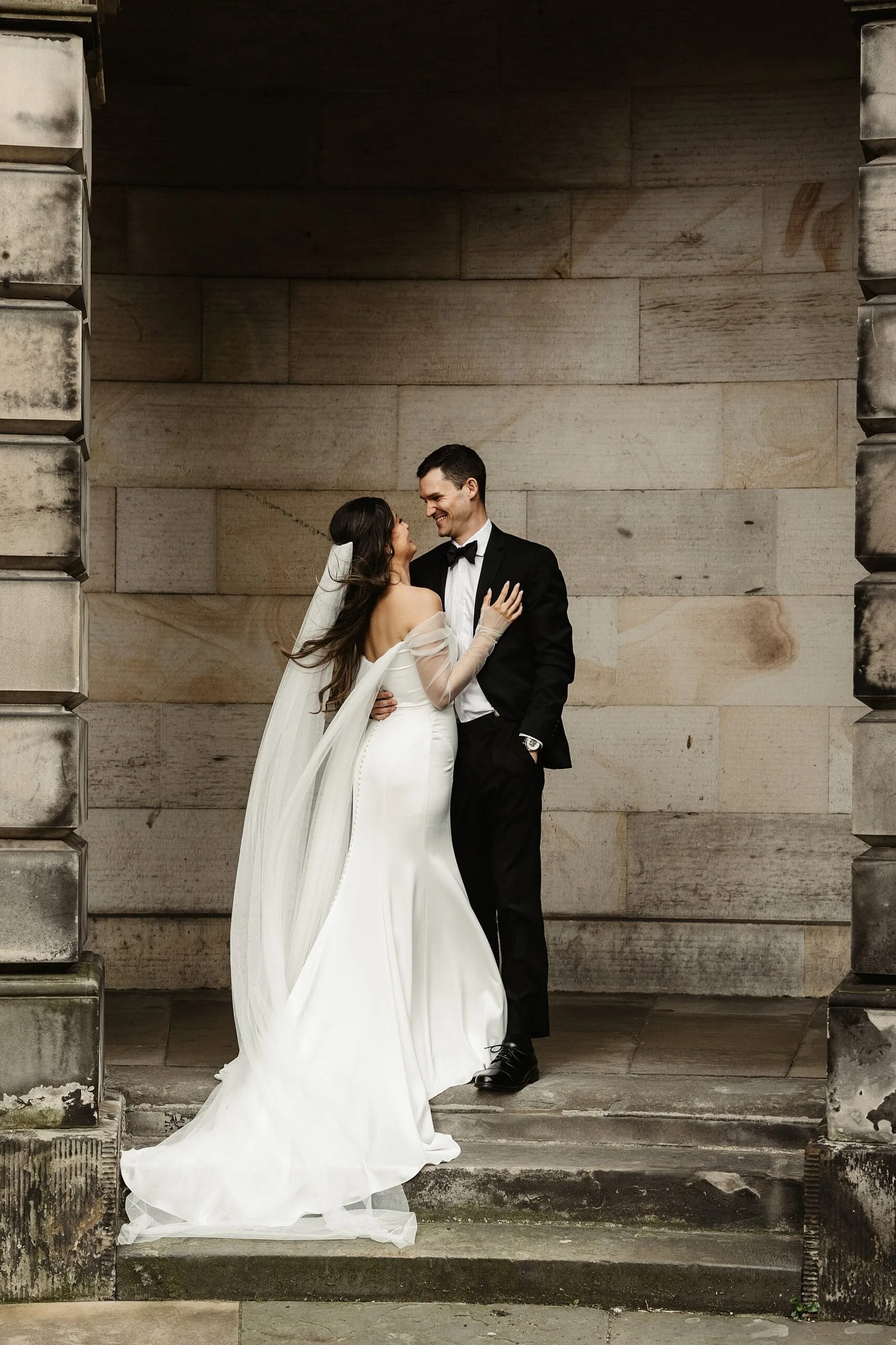 bride and groom wedding portraits edinburgh city centre elegant jenny yoo dress