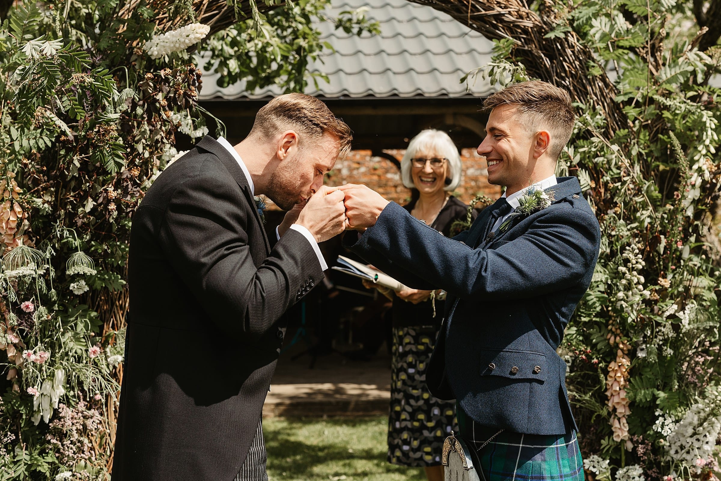 outdoor wedding ceremony at byre at inchyra same sex couple drinking champagne from the quaich