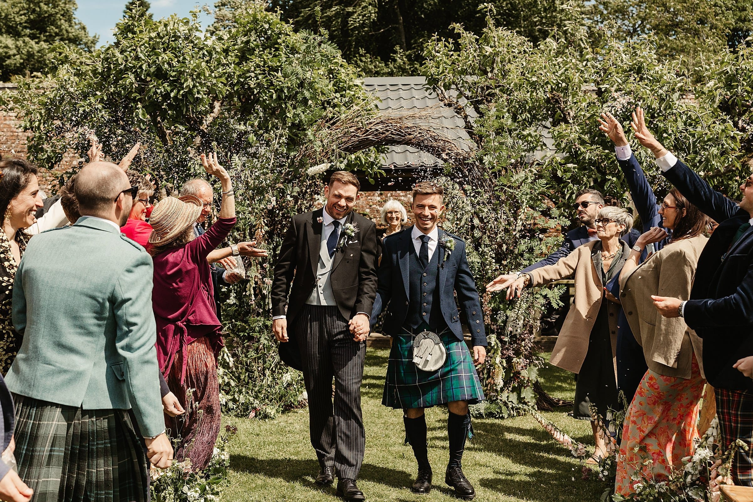 outdoor wedding ceremony at byre at inchyra same sex couple confetti